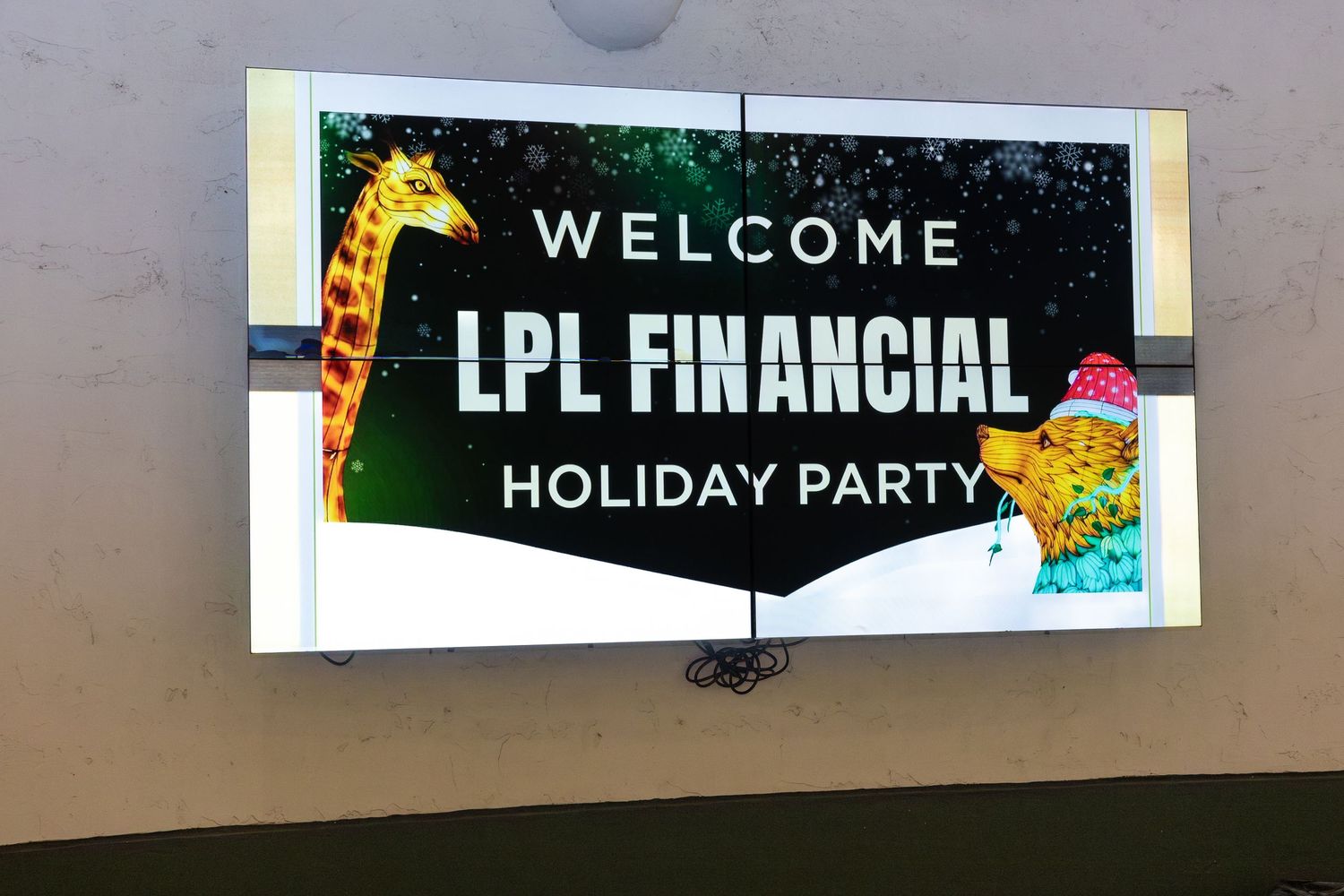 Welcome sign displayed at a holiday party event.