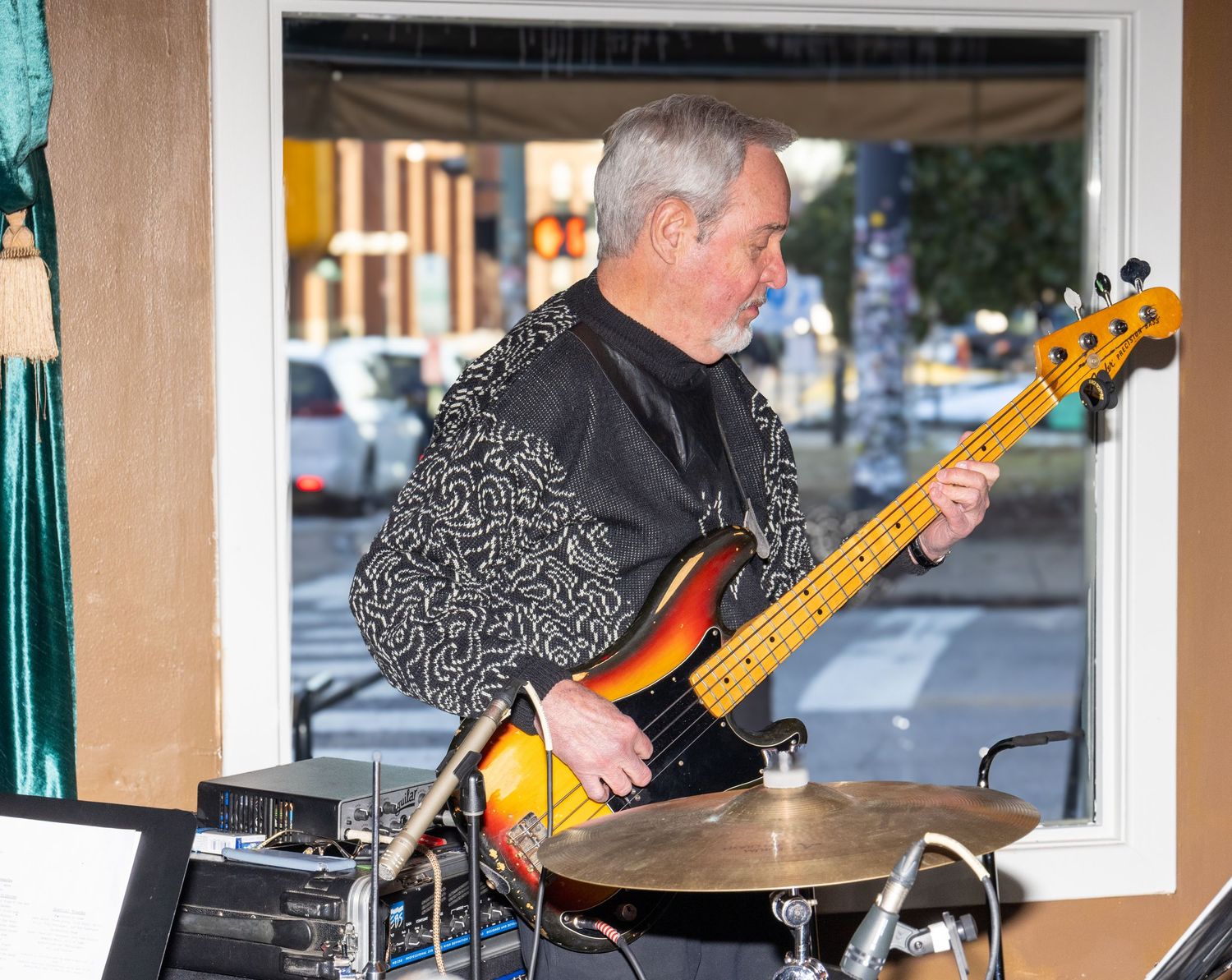 Musicians playing bass and drums during a live performance.
