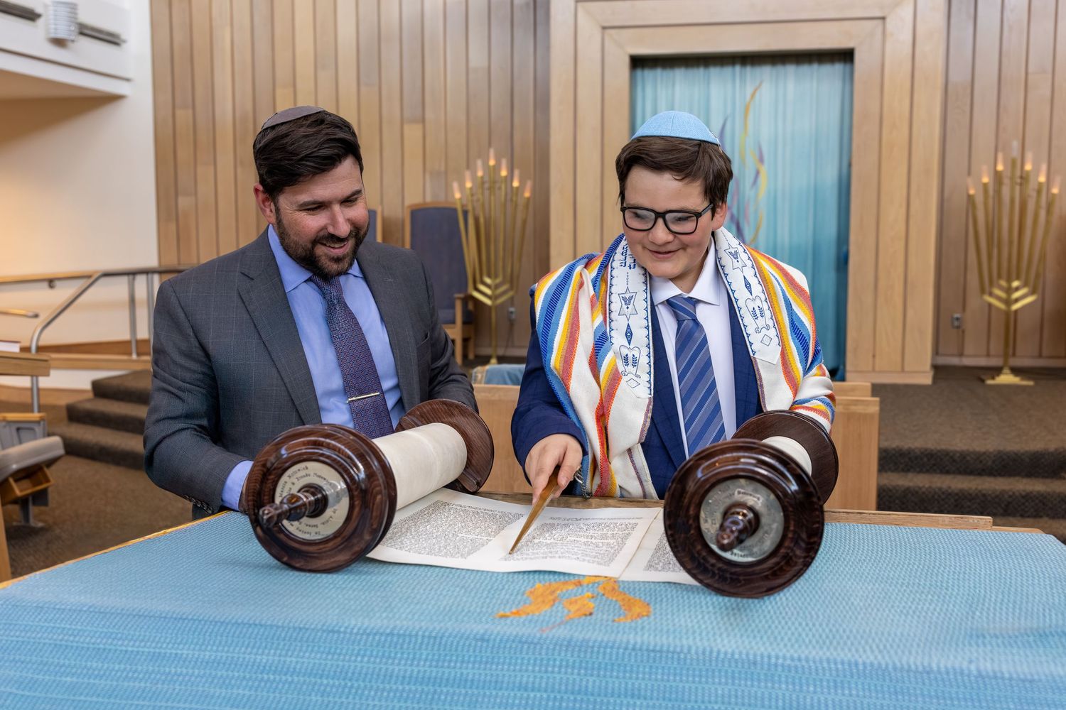 A series of business professionals signing documents and shaking hands in a modern office setting.