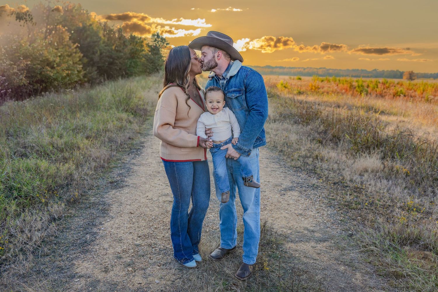 Candid family moments captured during sunset photo session in natural outdoor setting.