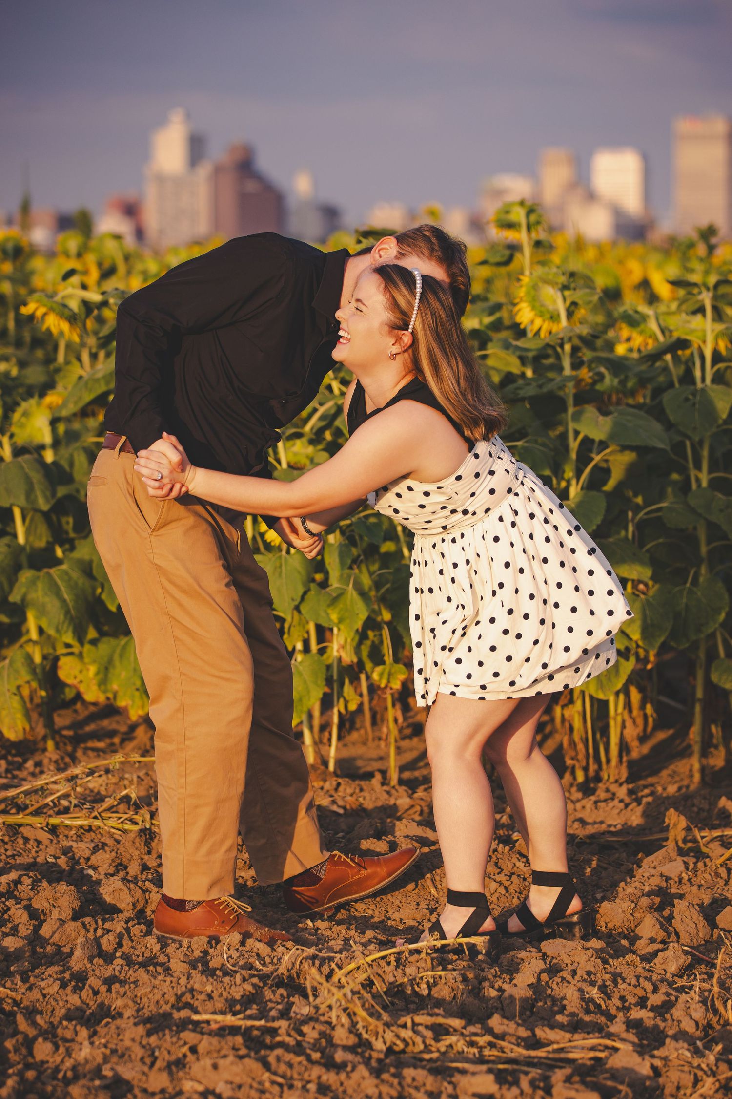 Dancing sequence in sunflower field during golden hour.