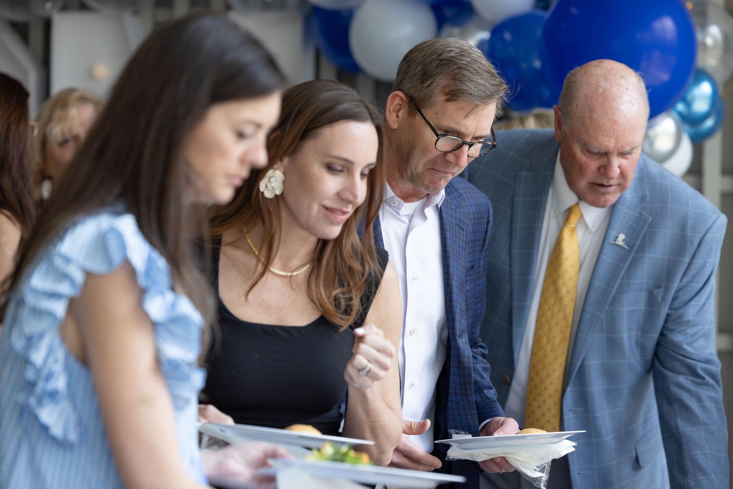 Business colleagues collaborating over documents at a conference table during a professional meeting.