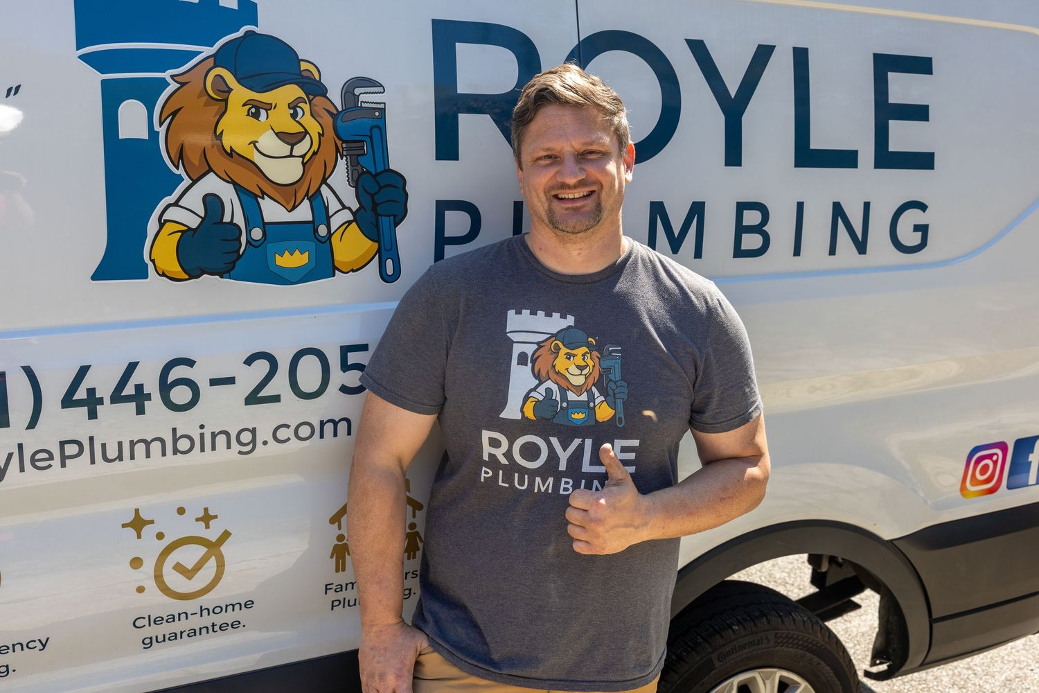 Smiling Royle Plumbing technician standing in front of branded service van with lion logo in sunny outdoor setting.