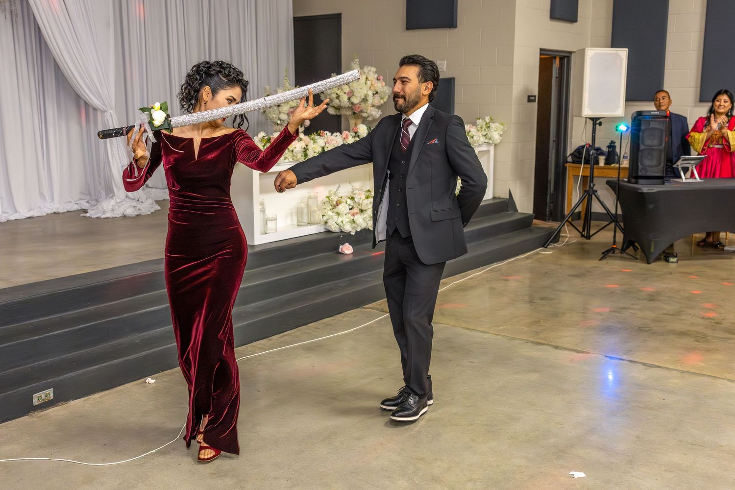 Wedding reception dance sequence showing couples dancing in formal attire on a ballroom floor.