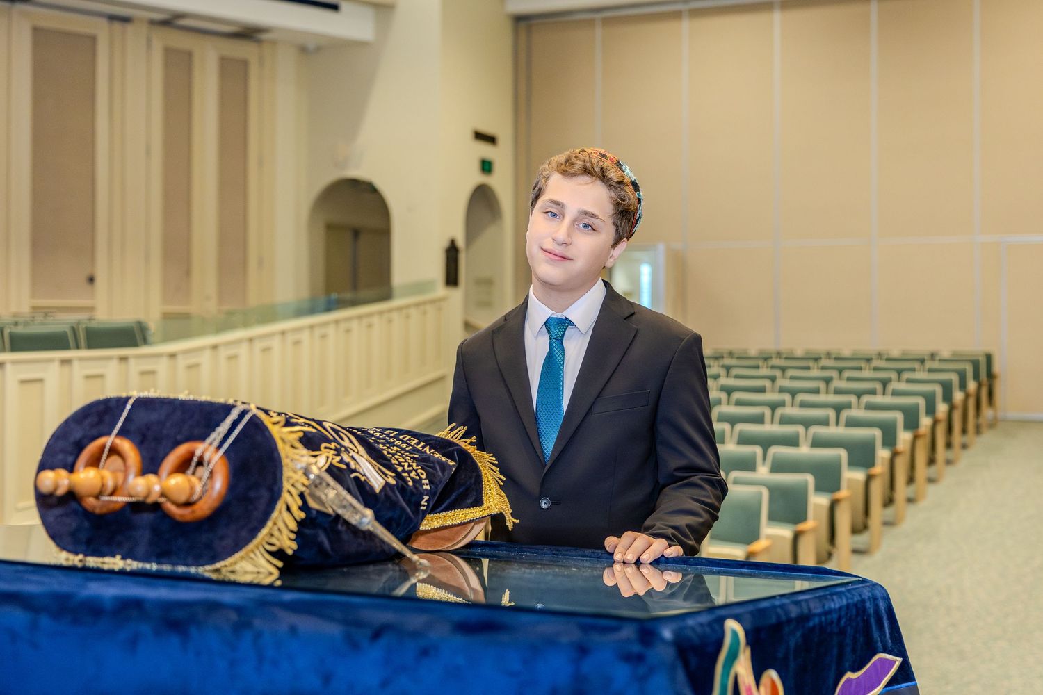 Professional musicians perform classical music on violins and cellos in a concert hall.