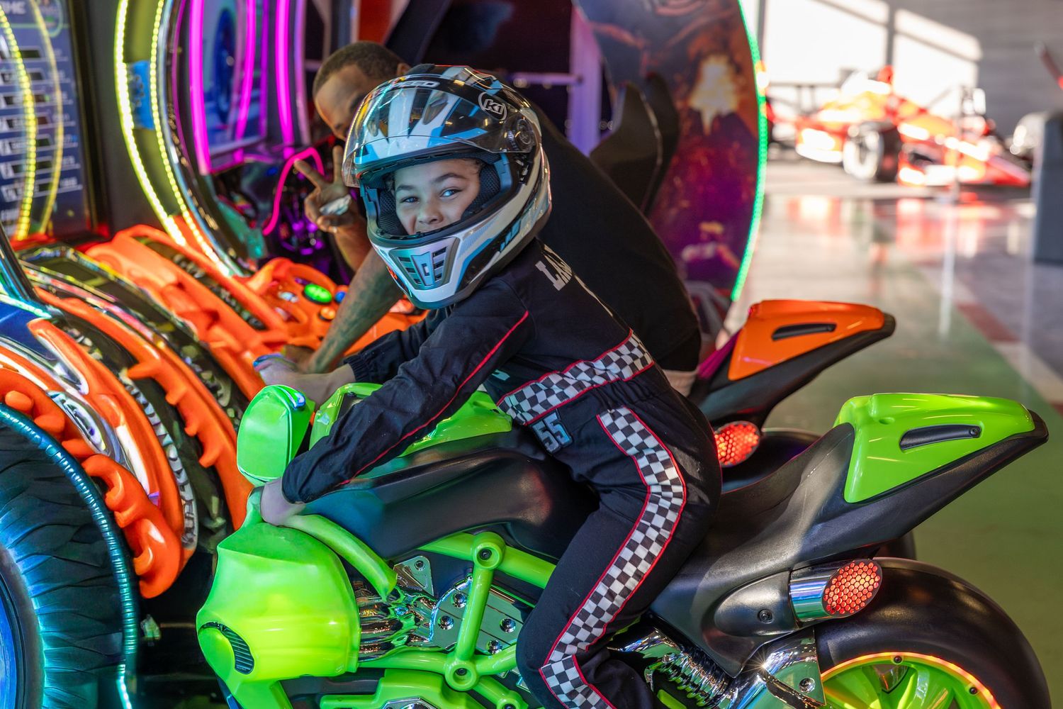 A colorful display featuring a toy motorcycle with bright neon decorations.
