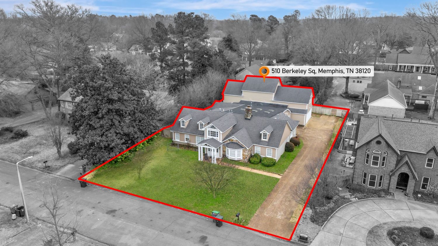 Aerial view of residential property boundaries marked with red lines showing parcel divisions and lot sizes.