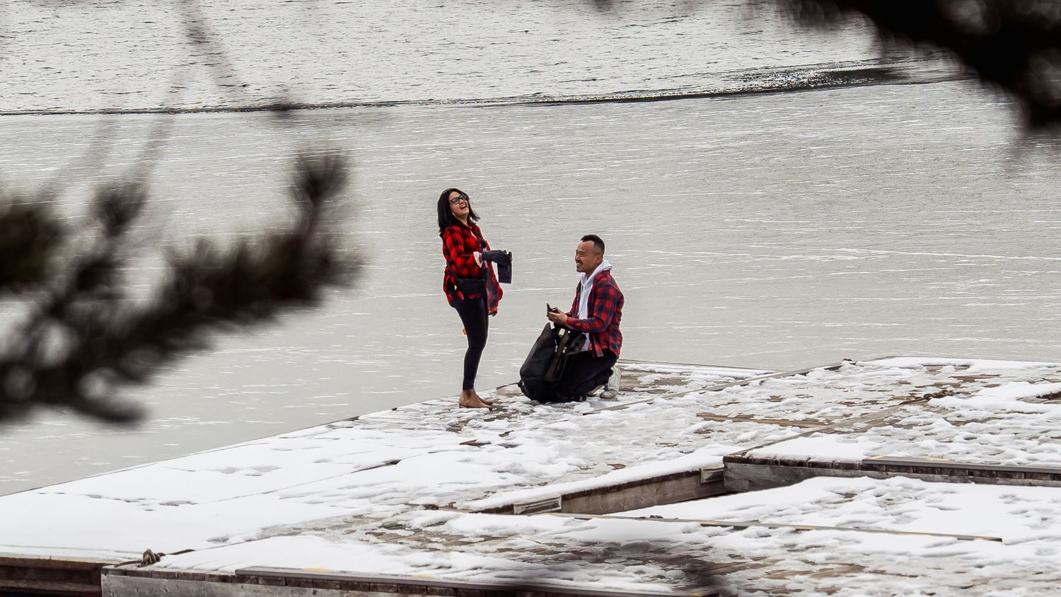 Two figures visible in the distance on a snow-covered landscape.