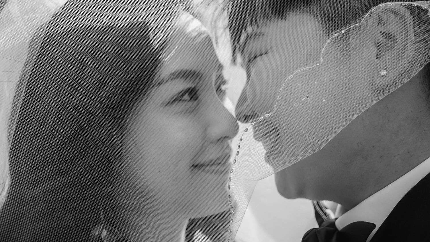 A romantic collage of black and white photos showing intimate couples in tender moments of love and affection.