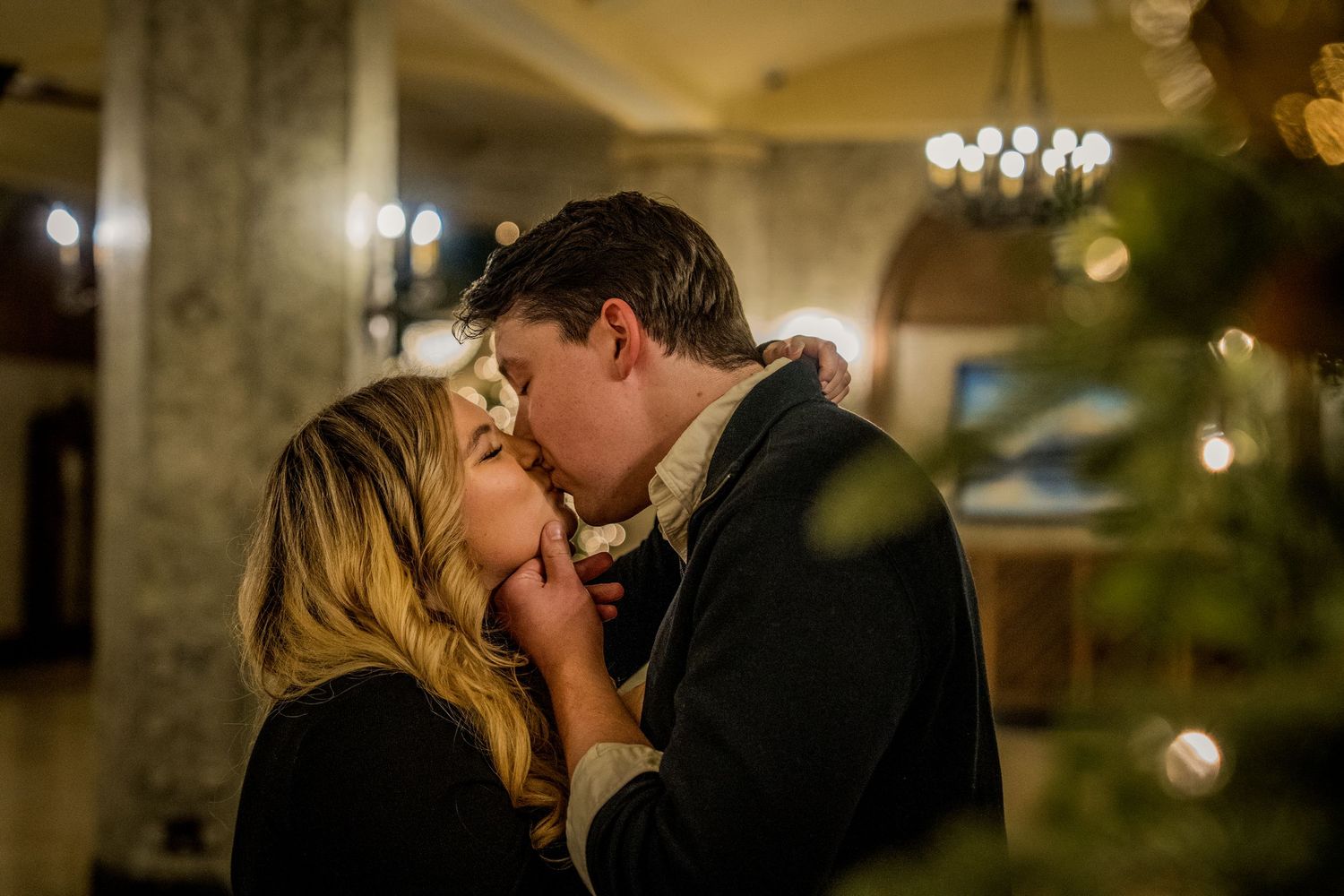 Romantic indoor scene with chandelier lighting and stone walls creating an intimate ambiance.
