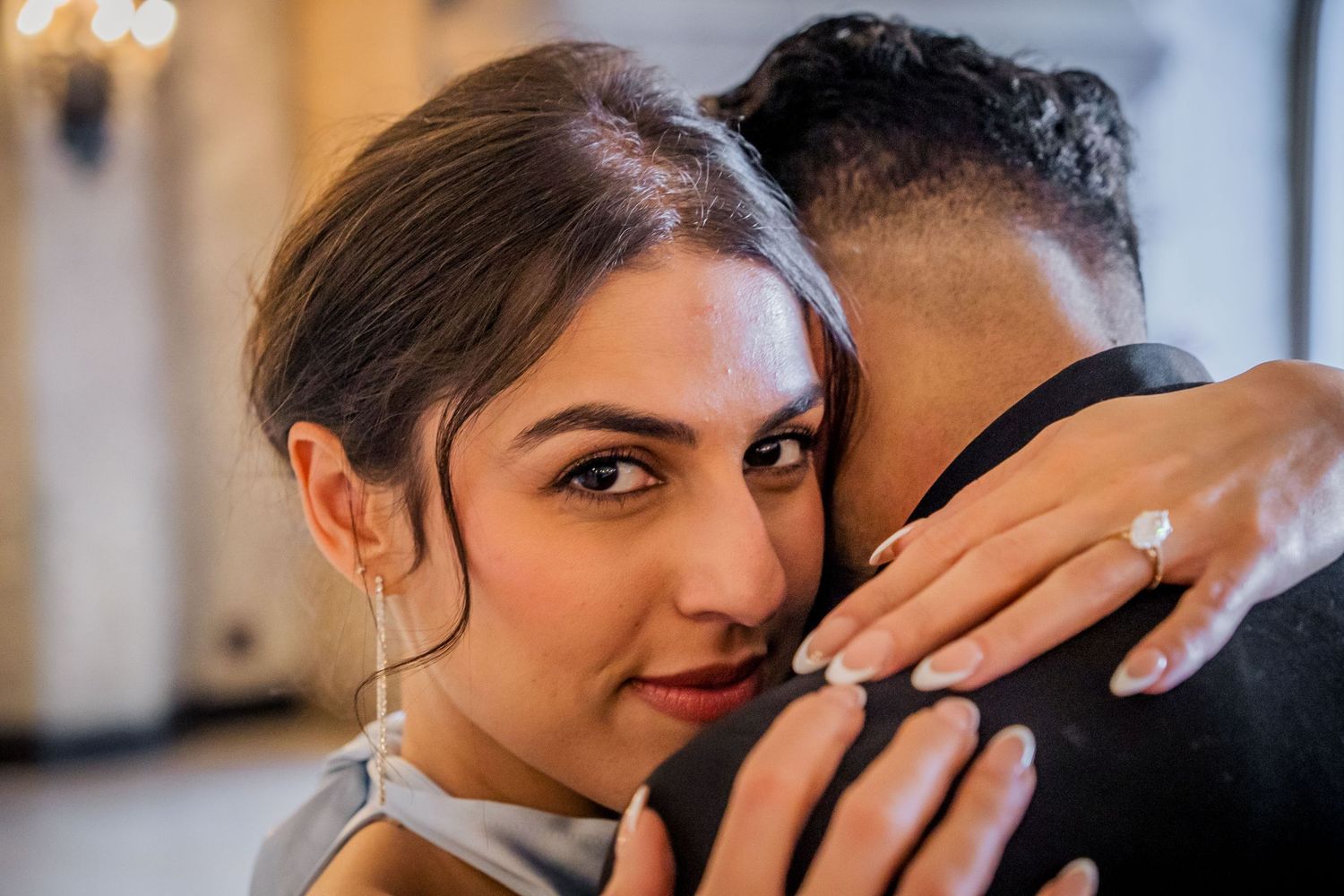 A romantic couple shares an intimate moment in a series of black and white wedding photos.