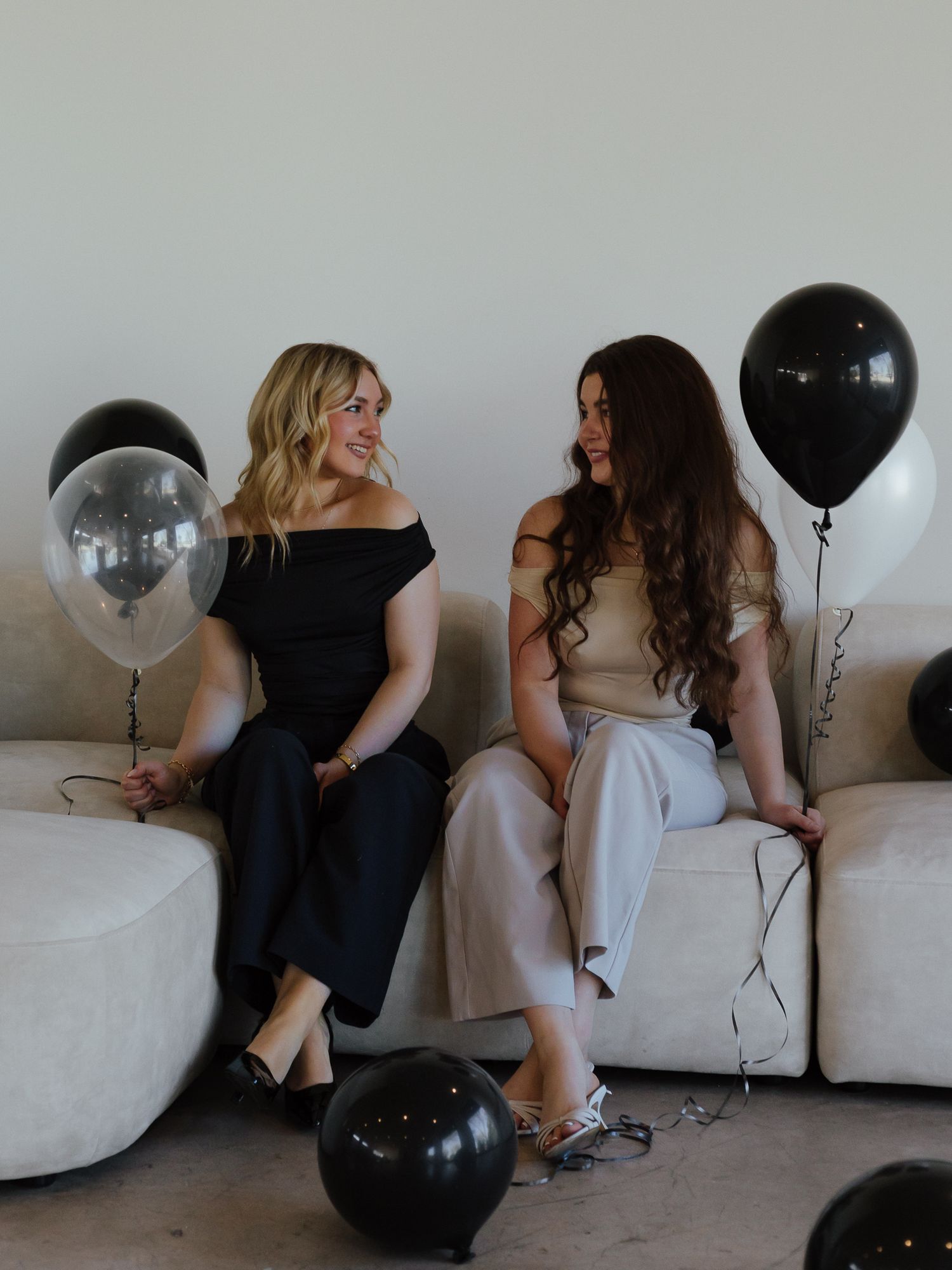 party planning buisinesss event brand shoot with two girls holding balloons in studio