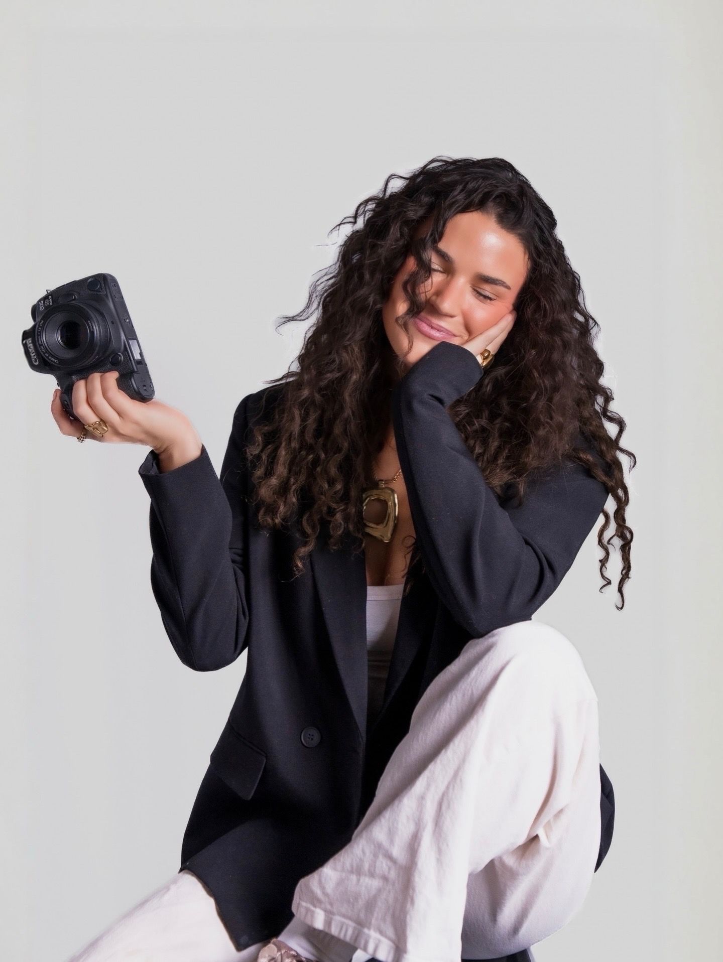kylee giancola professional headshot holding camera