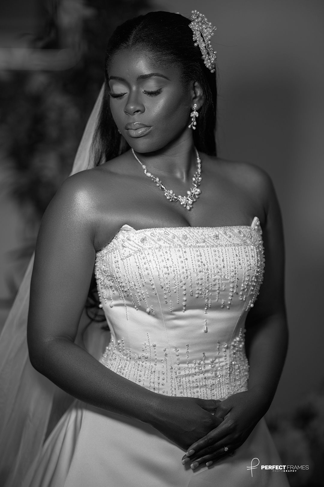 Elegant bride in a white wedding dress holding a floral bouquet, captured in soft light, showcasing bridal beauty, romance