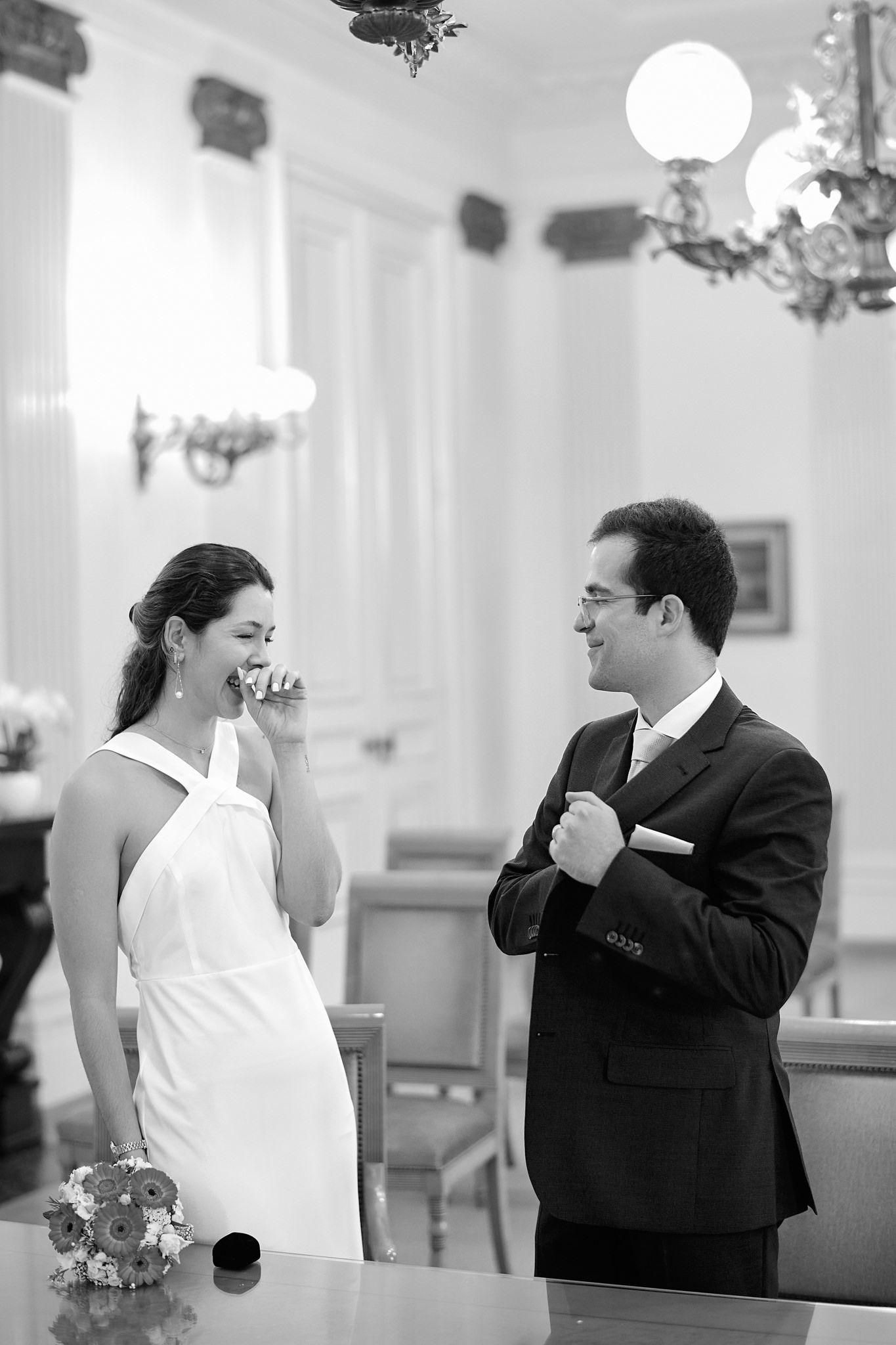 Black and white sequence of wedding couple dancing in elegant indoor setting.