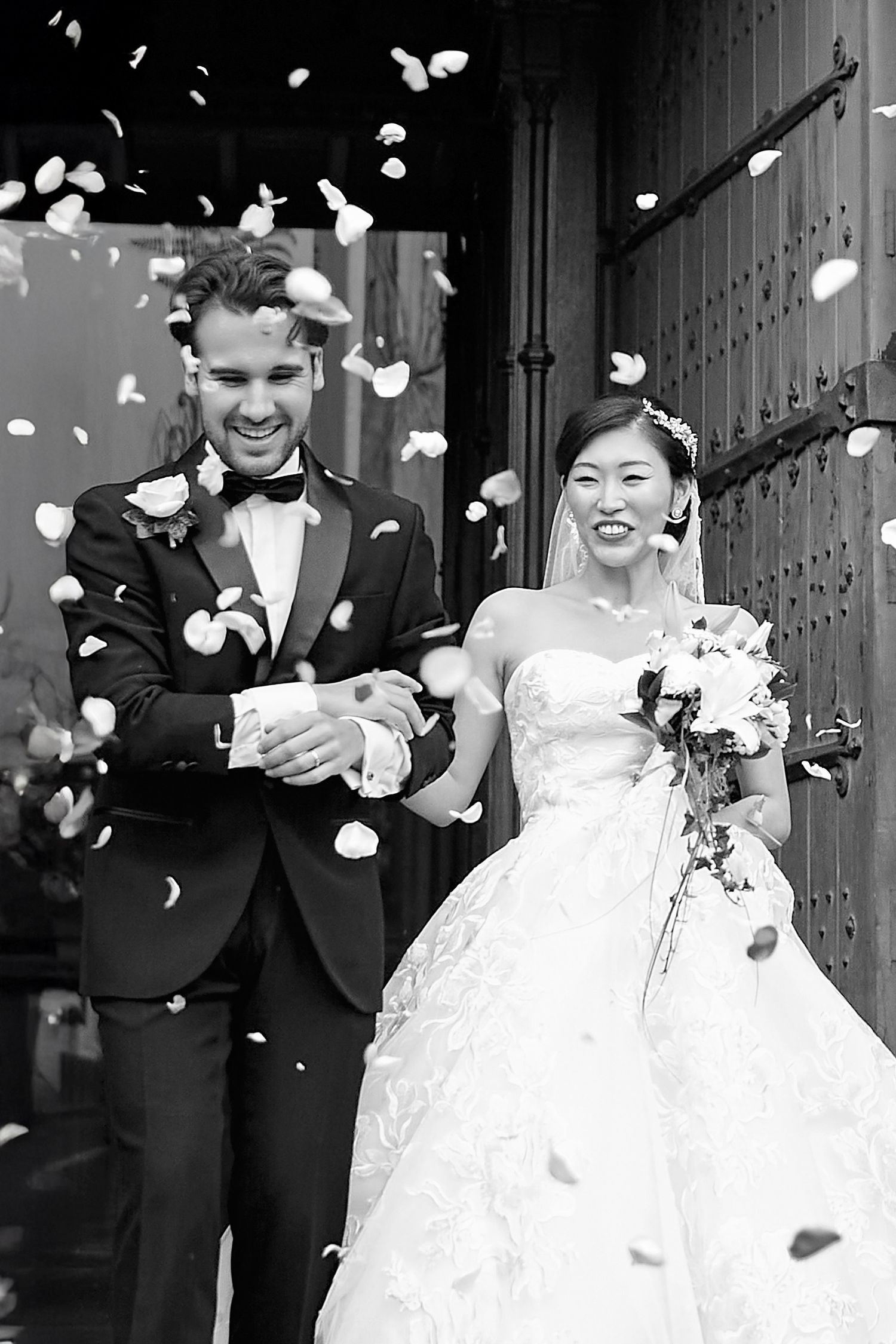 Black and white sequence of newlyweds celebrating with flower petals.