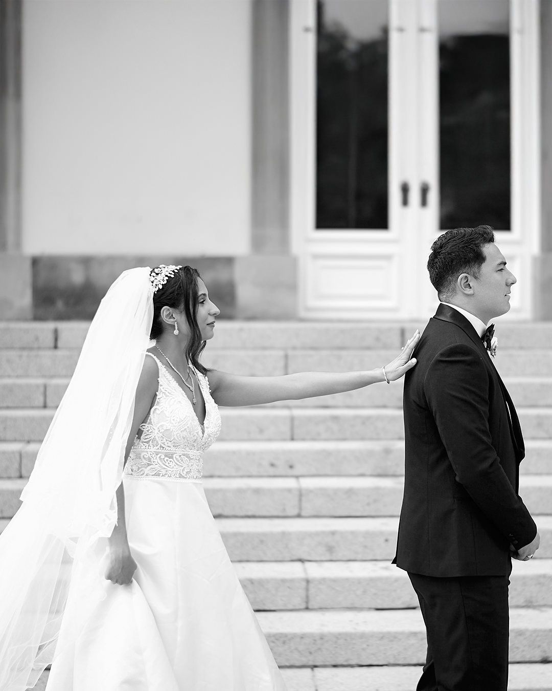 Wedding first look sequence showing a bride and groom on church steps.
