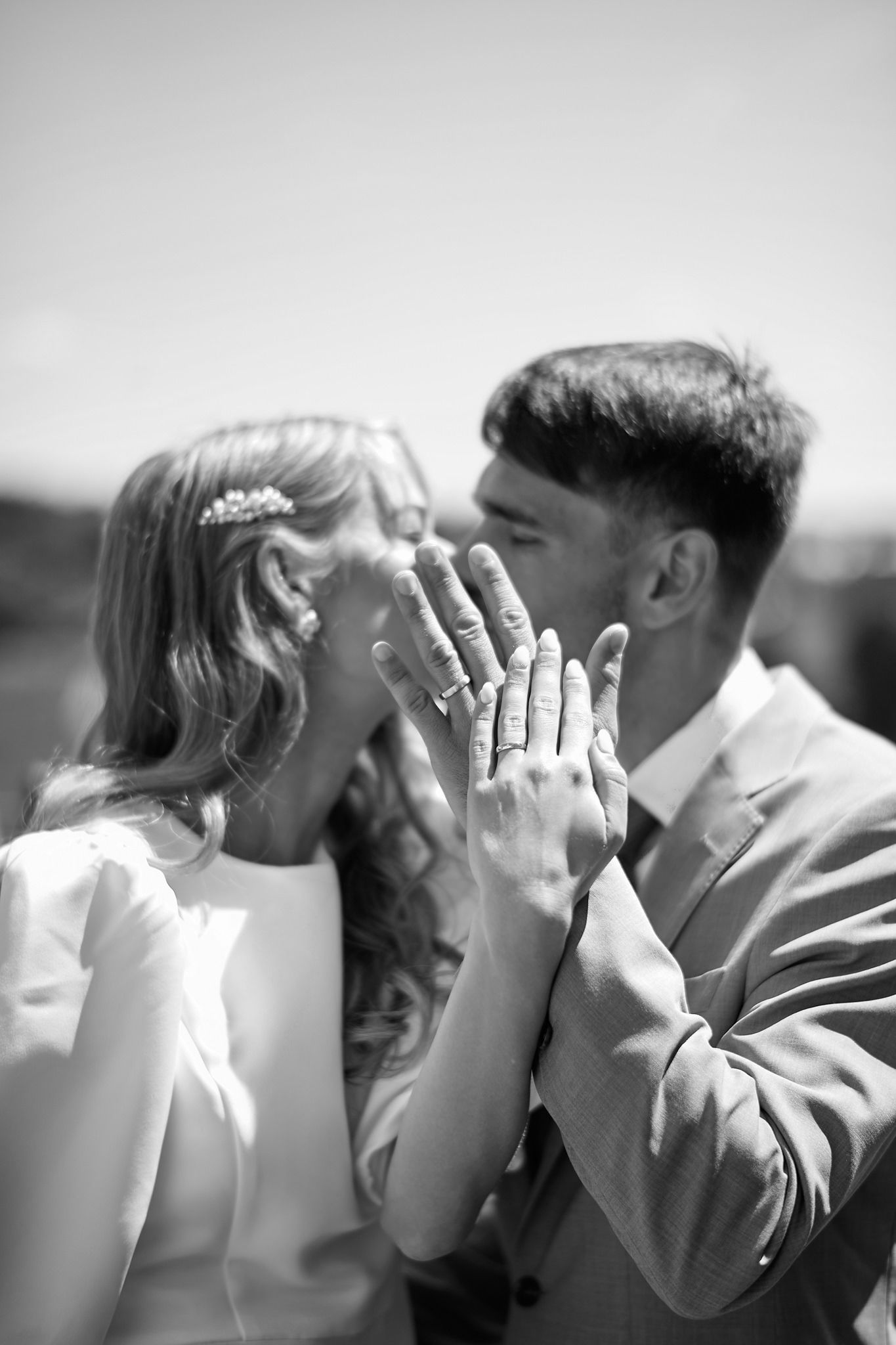Romantic black and white sequence of a couple sharing intimate kisses.