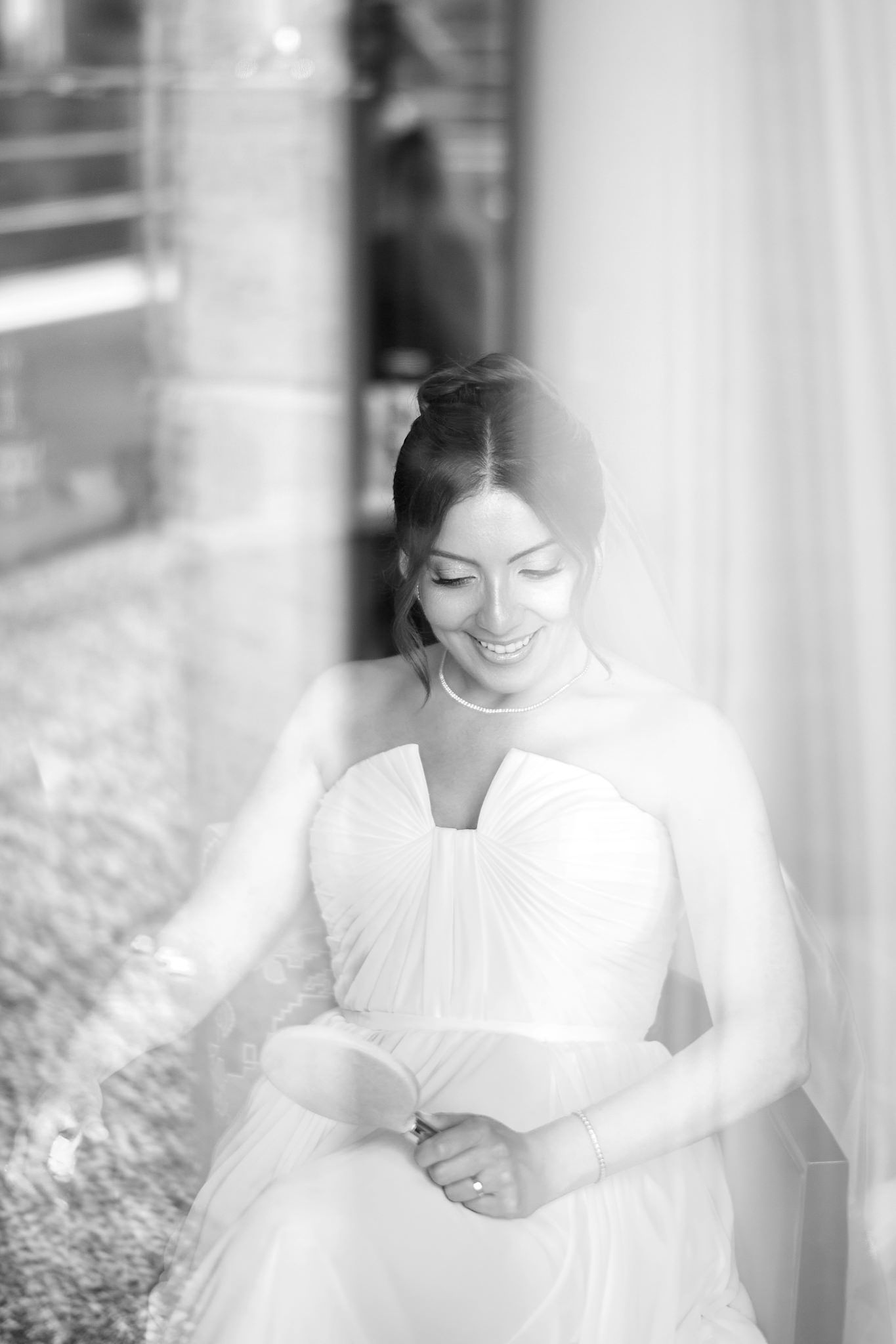 Soft focus bridal portraits in white showing gentle expressions through window light.