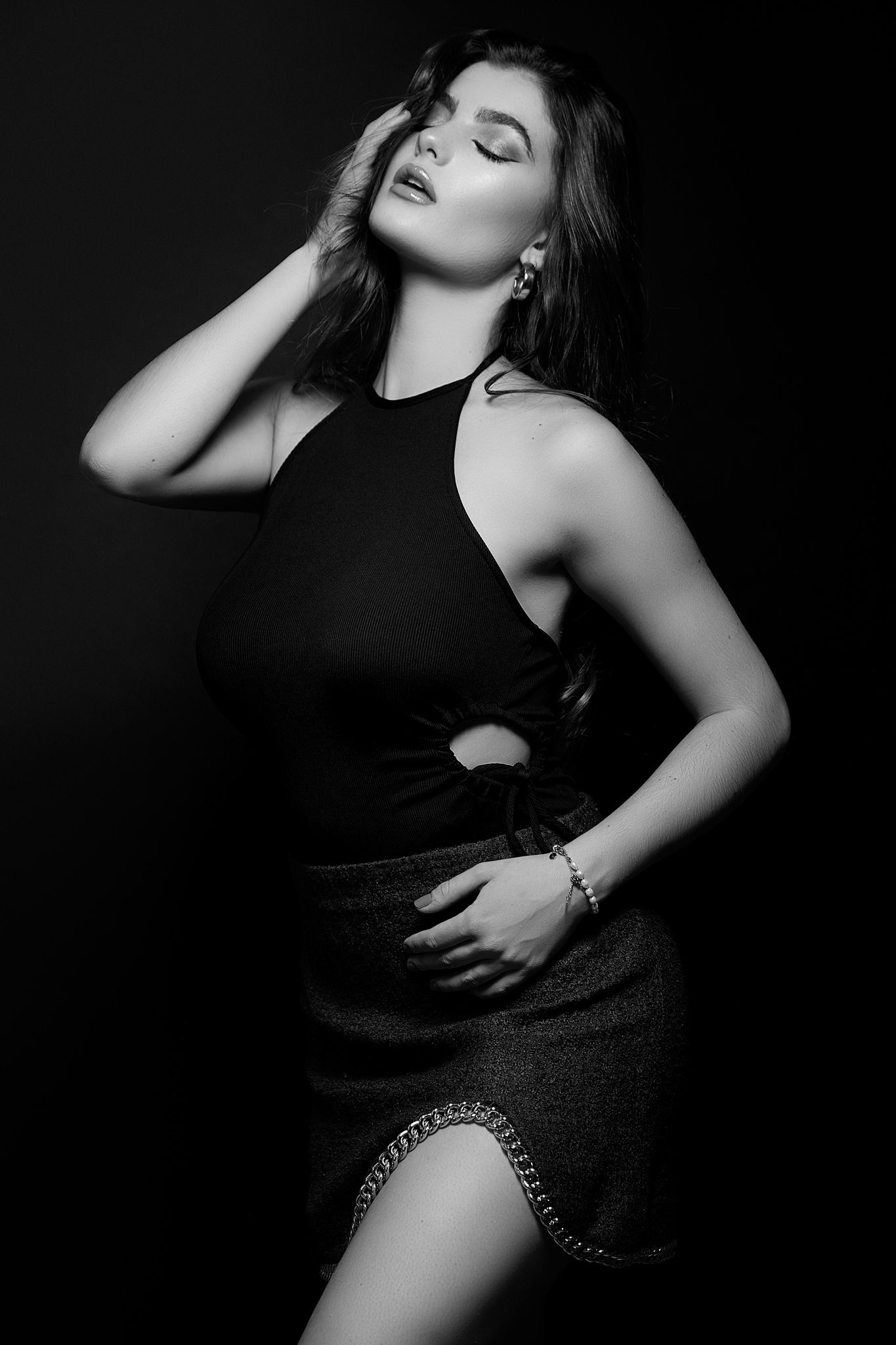 Artistic black and white fashion portraits showcasing dramatic poses and lighting.