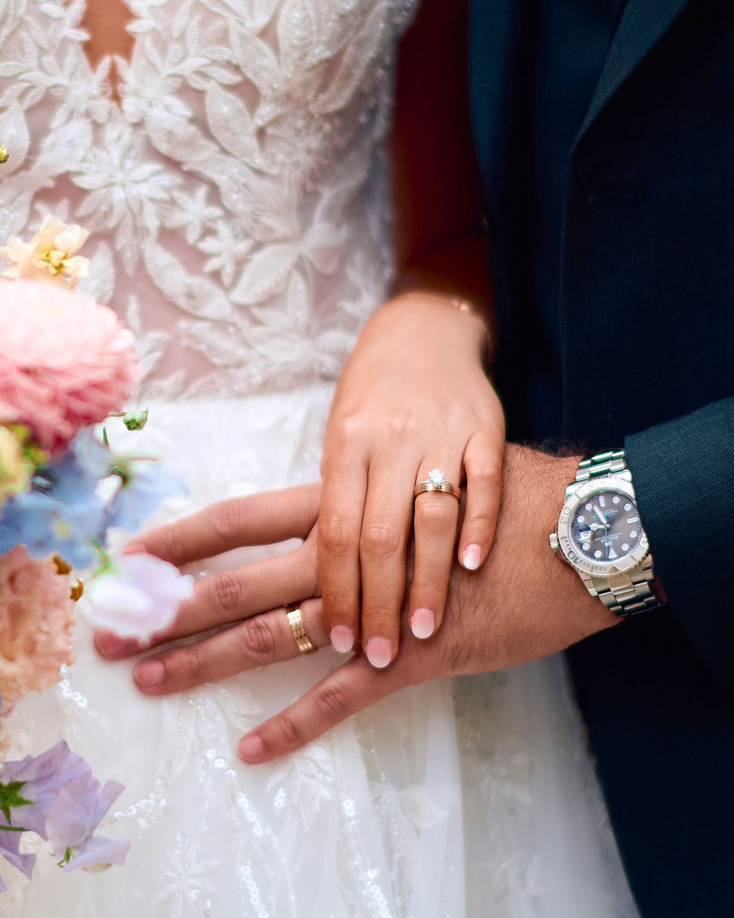 Close-up shots of wedding rings and hands during a ceremony.