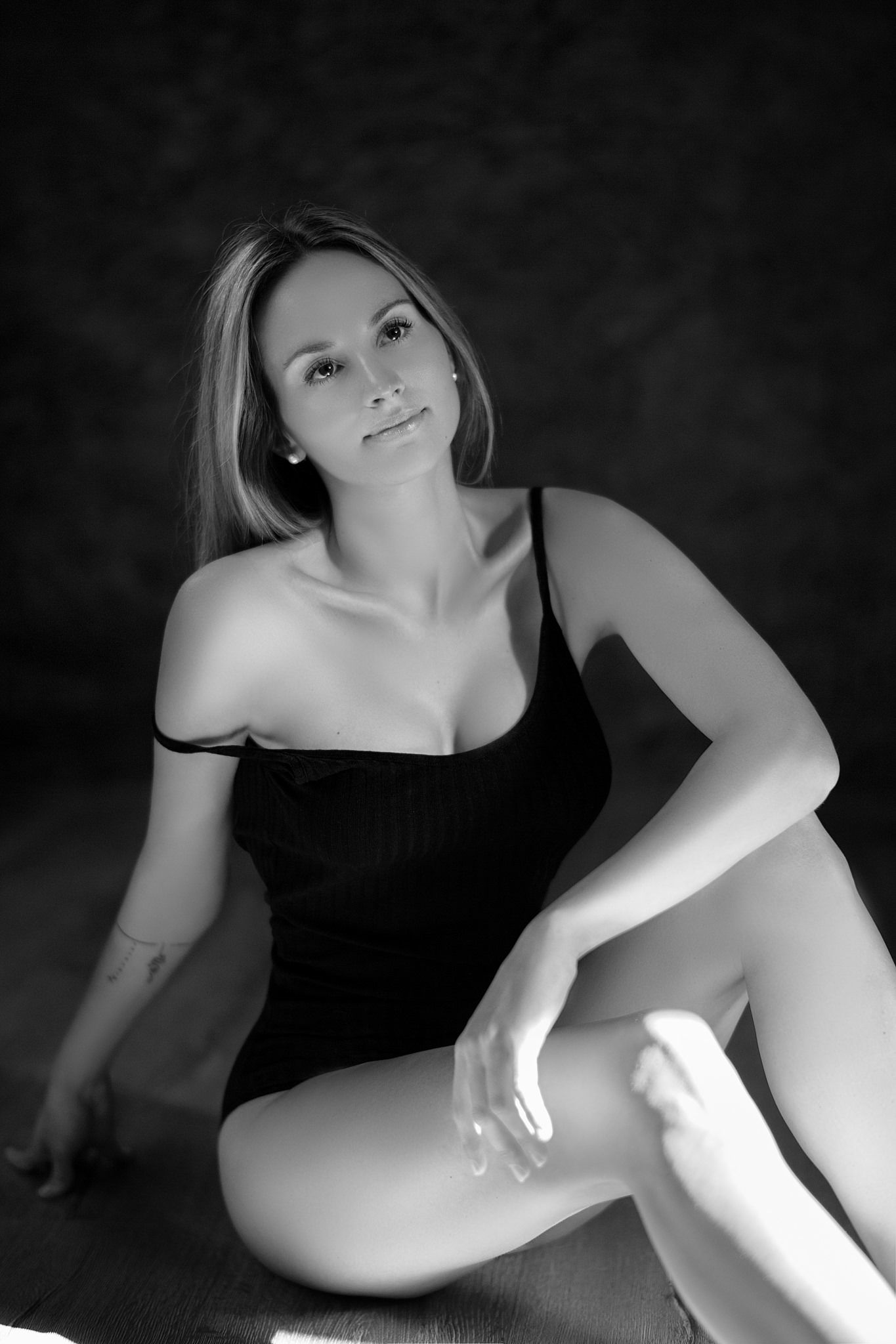Artistic black and white photography series showcasing dramatic poses and lighting effects.