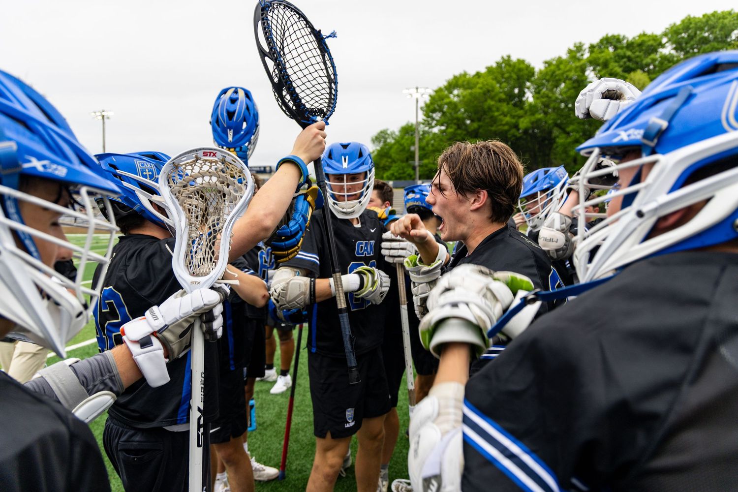 Davis Nickloes leads the huddle getting ready for the USN game