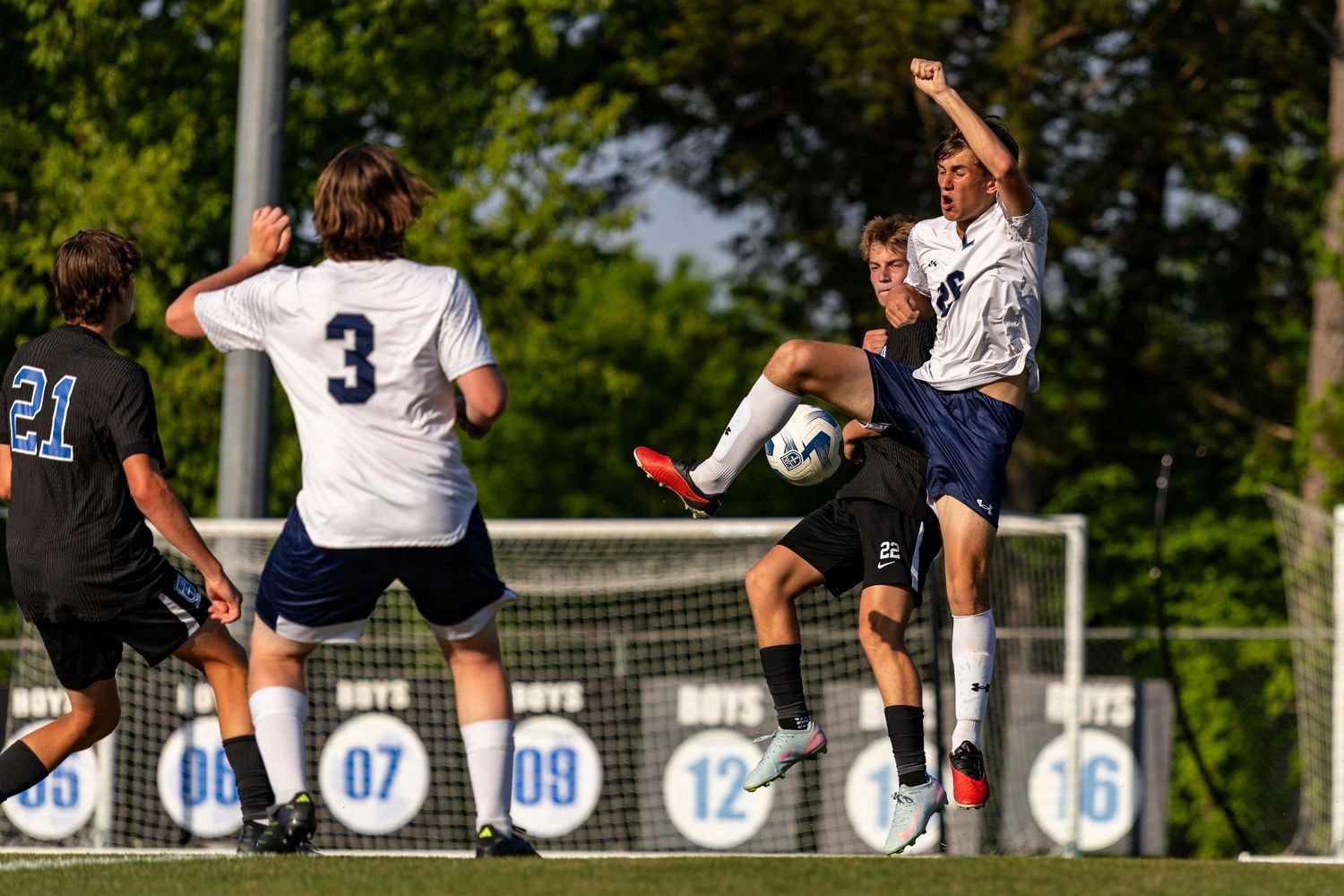 Player Mason Fawver attempts to get the ball against a Concord High School player