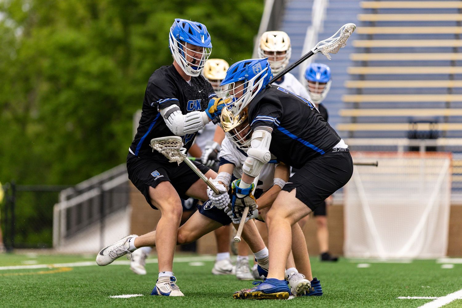 Players Andrew Dungan and Silas Oler hit a PJPII player