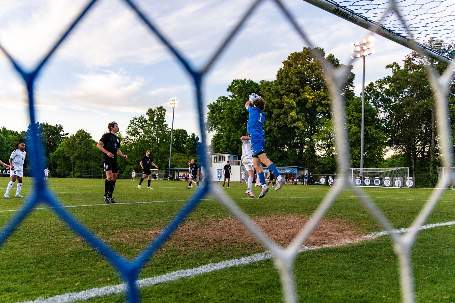 Goalie Colby Stokely saves a shot by a Concord High School player