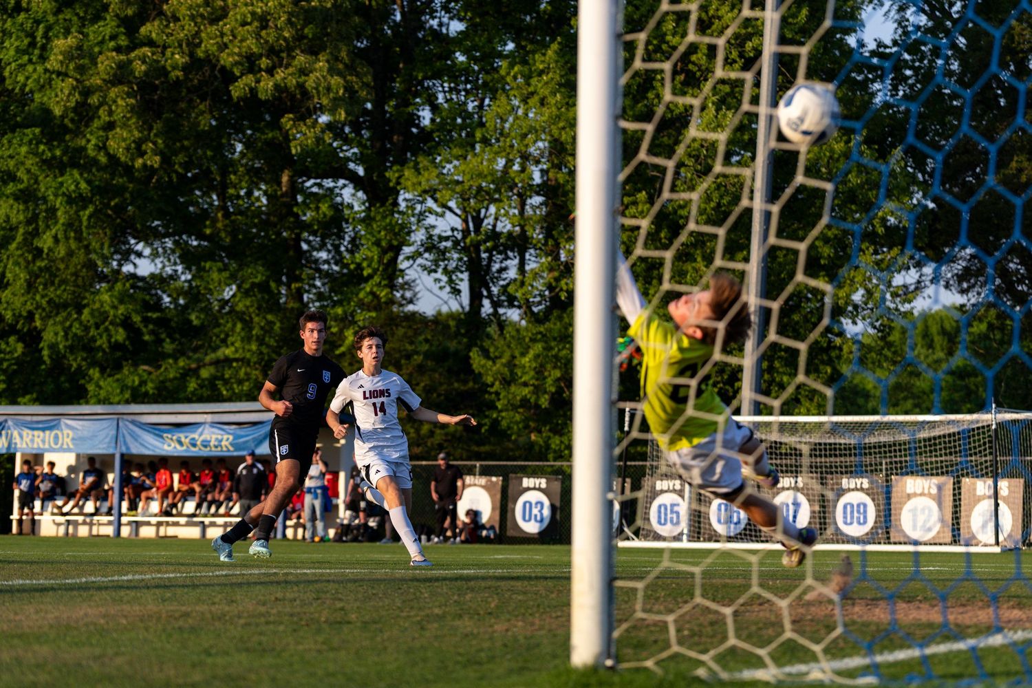 Player Elijah Krakawski scores against North High School