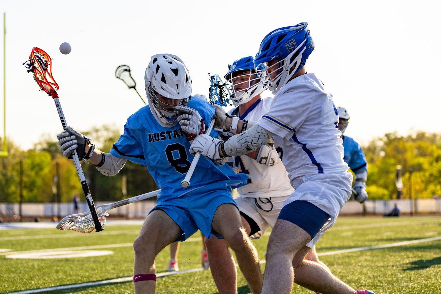 Players Tucker Mann and Liam Bradshaw knock the ball out of a Walker Valley players stick