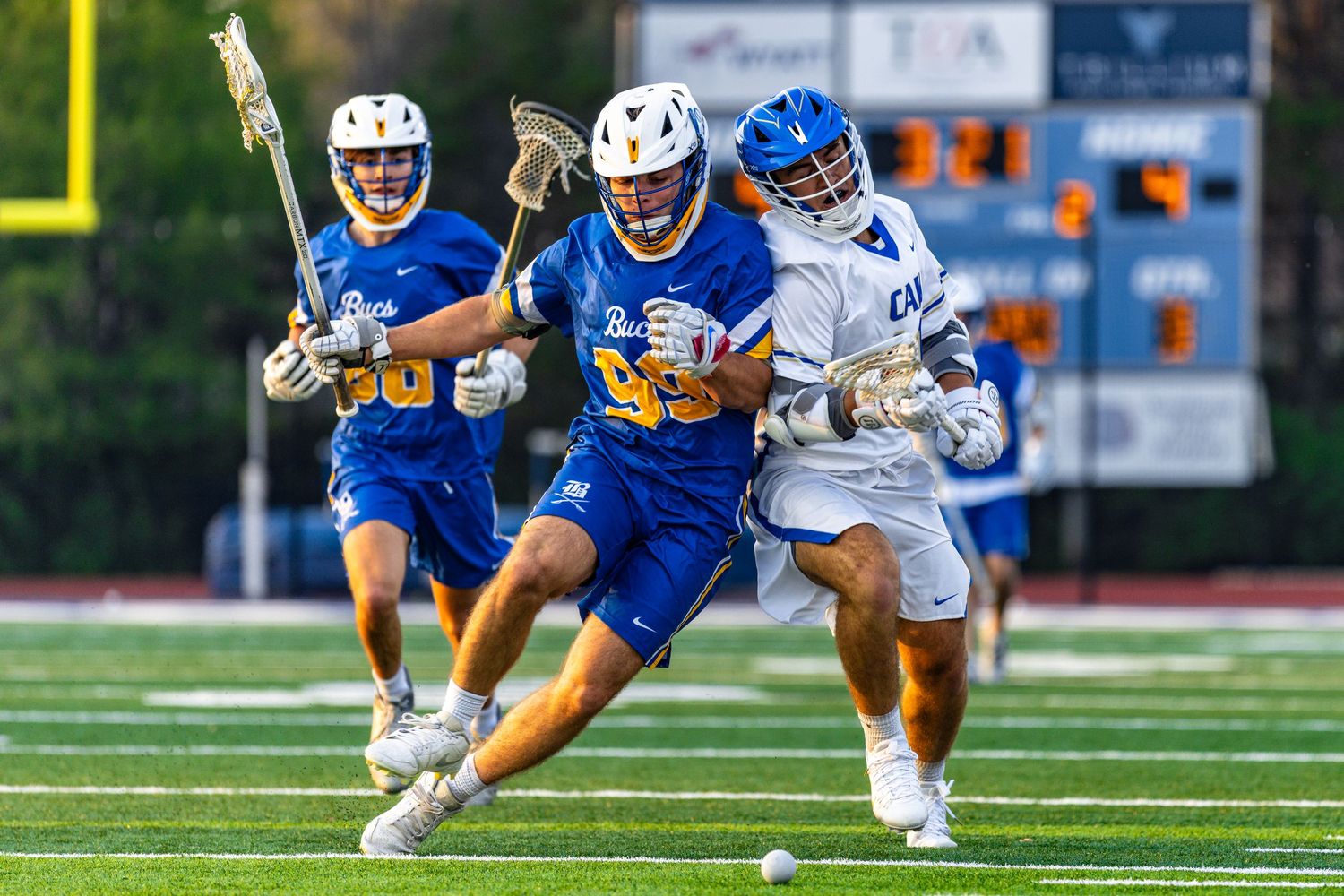 Player Kyler Cook and a Walker Valley player in pursuit of the lacrosse ball