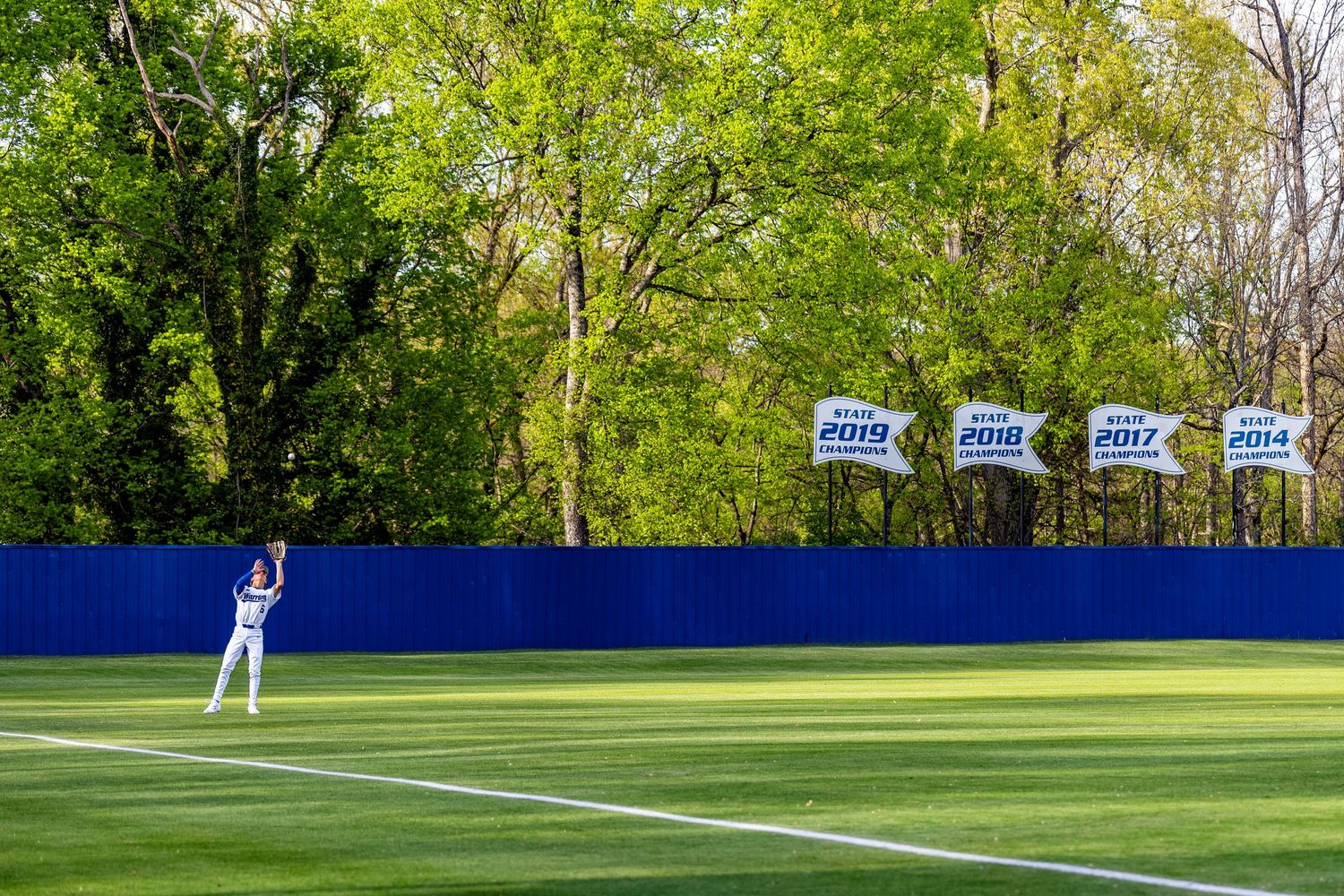 Player Beckett Rich catches a ball hit to deep left field by Concord High School
