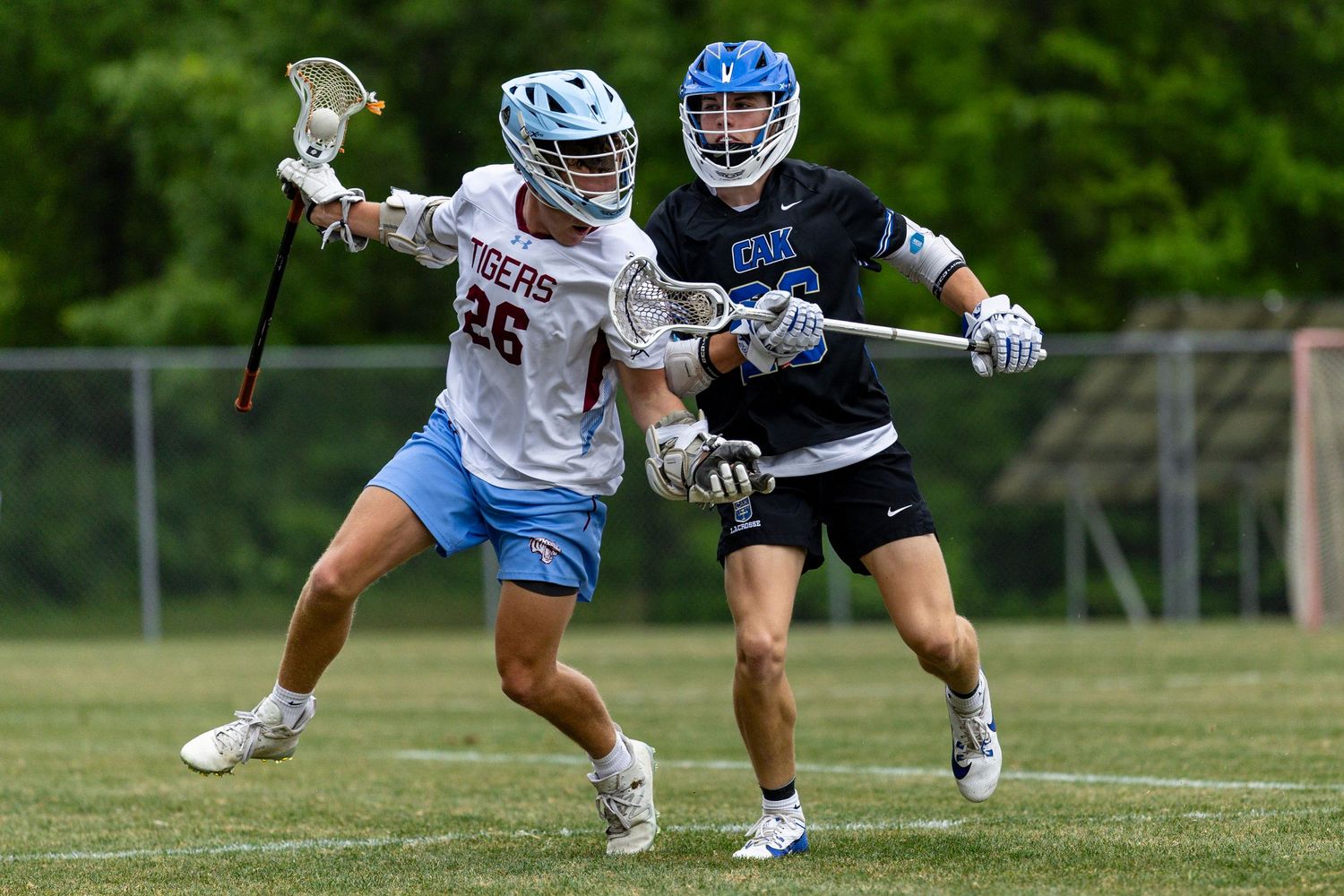 Player Davis Nickloes checks a USN player