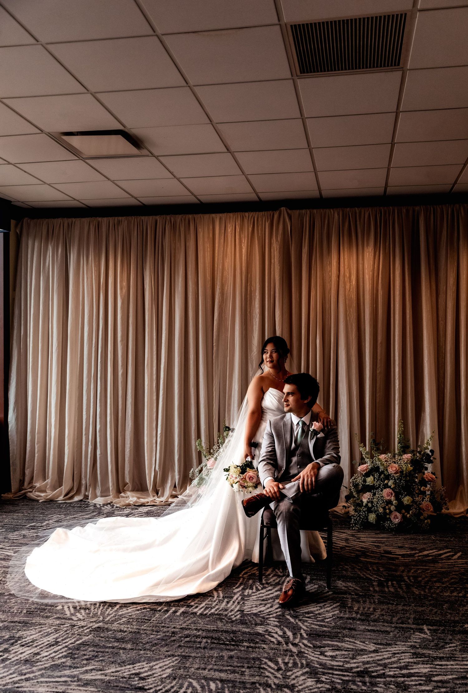 A dramatic sequence of black and white wedding photos showing a flowing bridal gown train against white curtain backdrop.