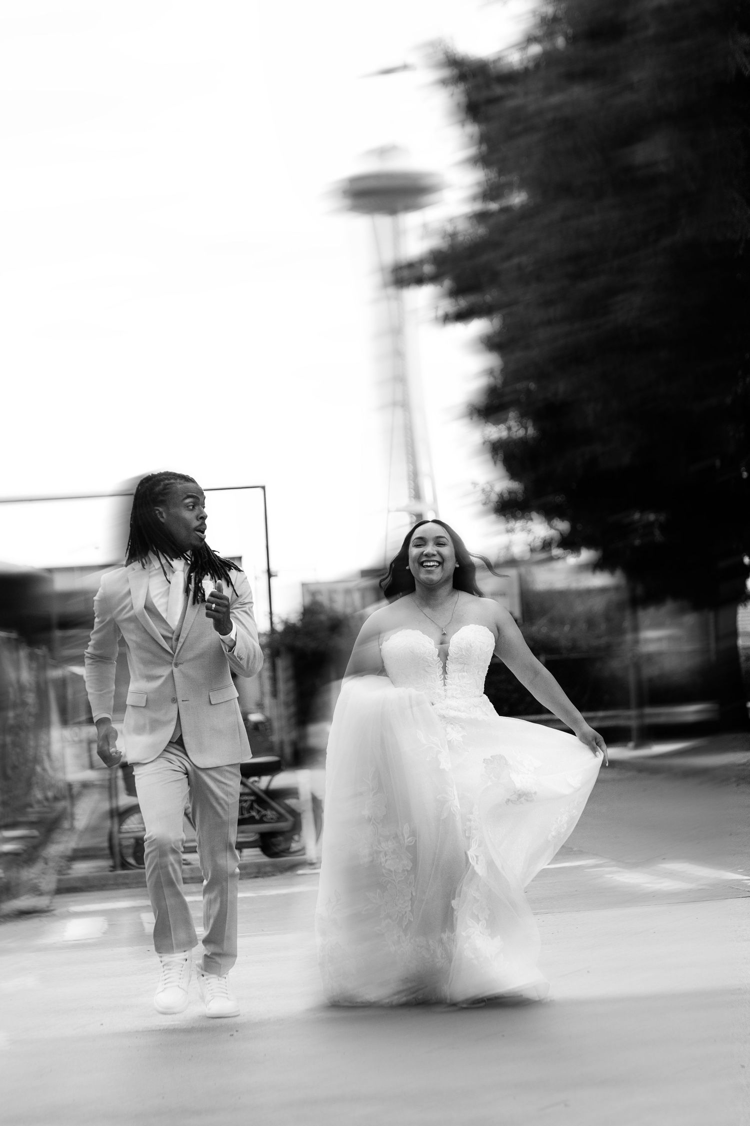 An artistic motion-blur series of a wedding couple walking outdoors in black and white photography.