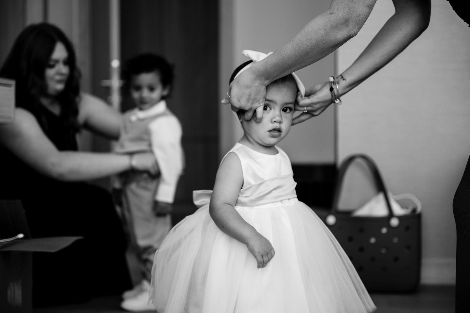 Black and white candid shots of wedding dance floor moments in a reception hall.