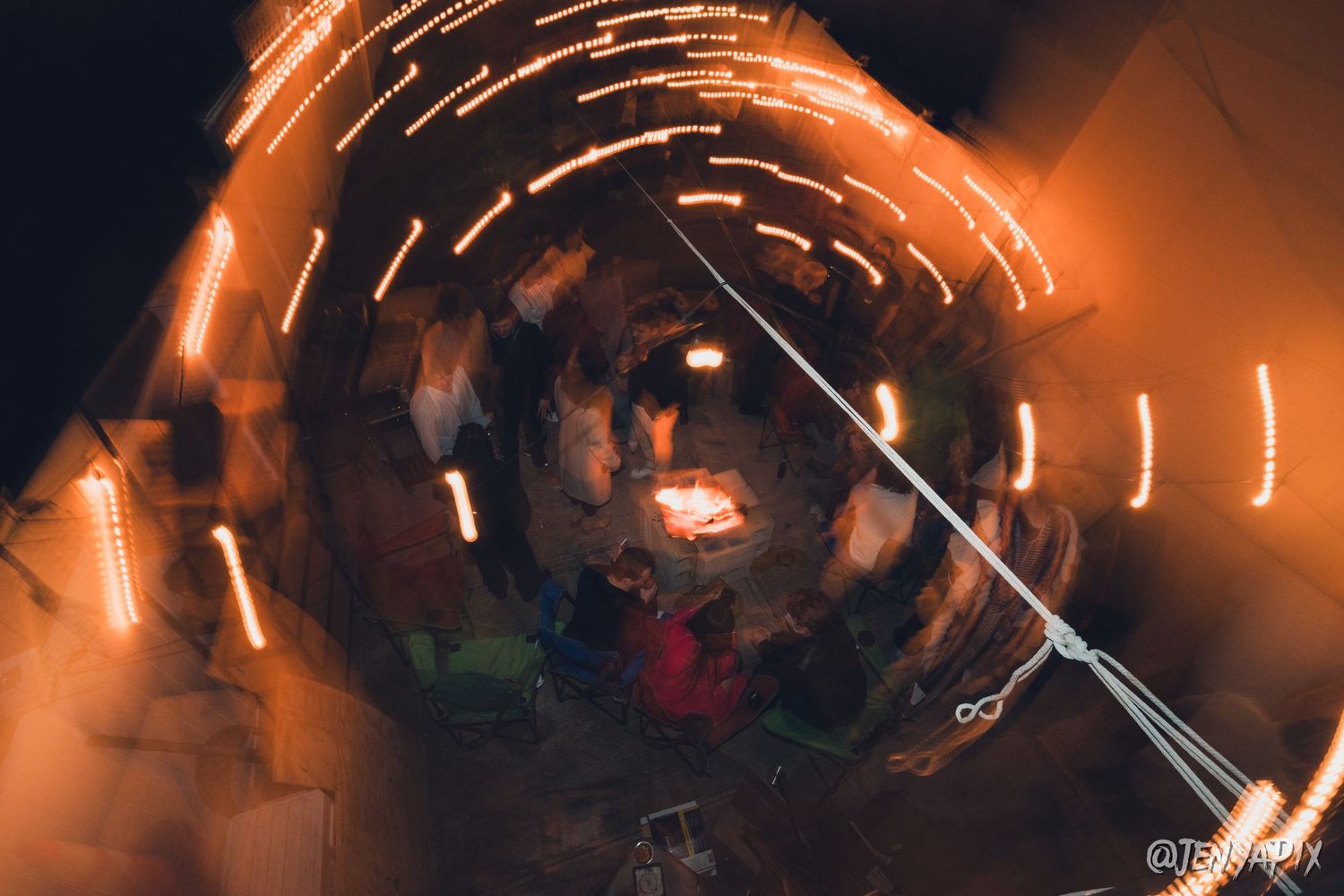 Creative long exposure shot showing light trails in a dark indoor space.