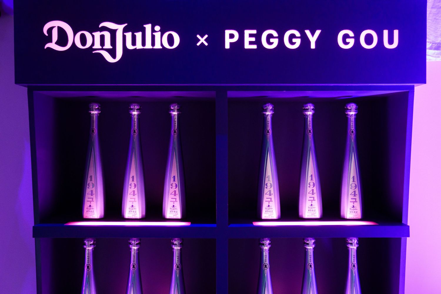 Don Julio x Peggy Gou branded display with illuminated bottles.