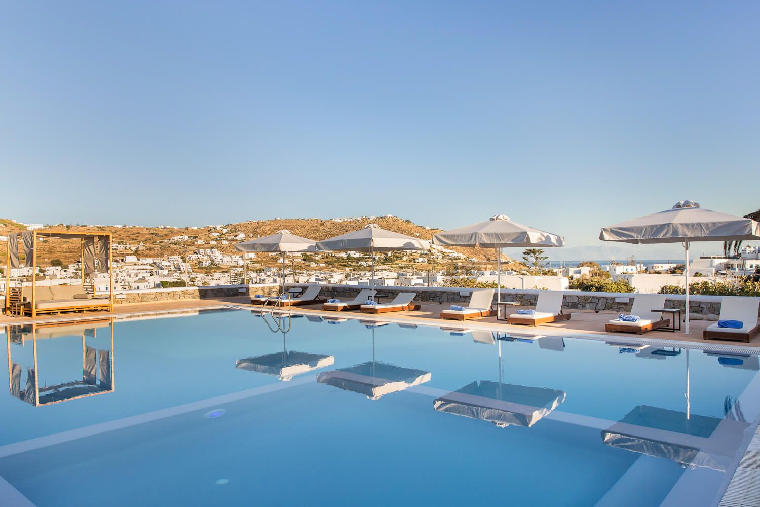 Clean water reflections complementing the resort's modern design