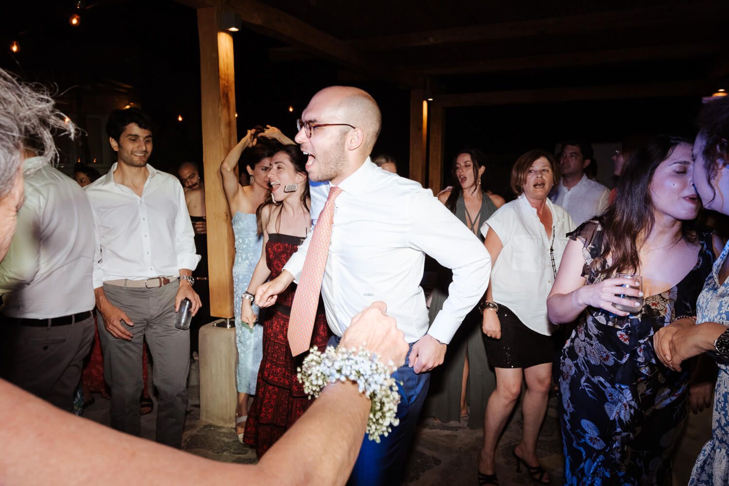Authentic Greek dancing at a traditional island wedding celebration