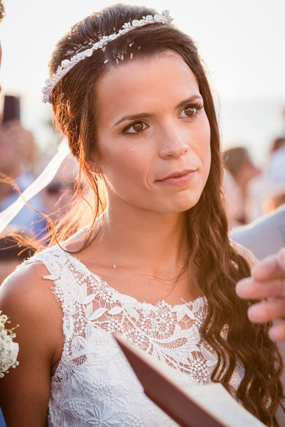 Spanish-Greek wedding ceremony in a white chapel in Milos