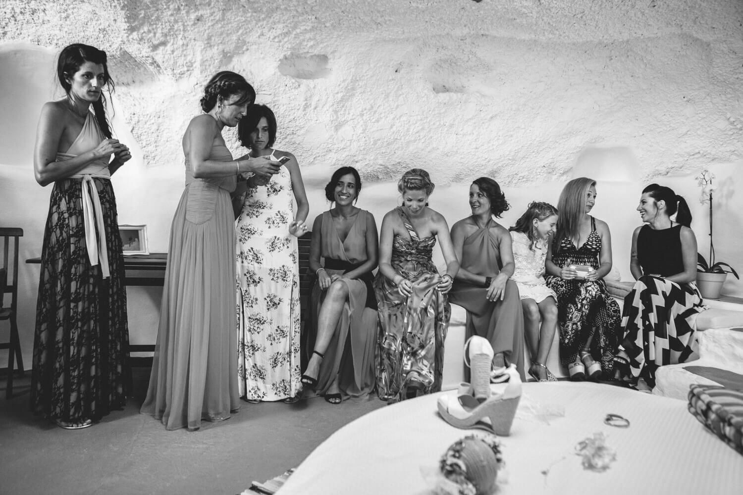 Spanish bride with bridesmaids having fun during preparation