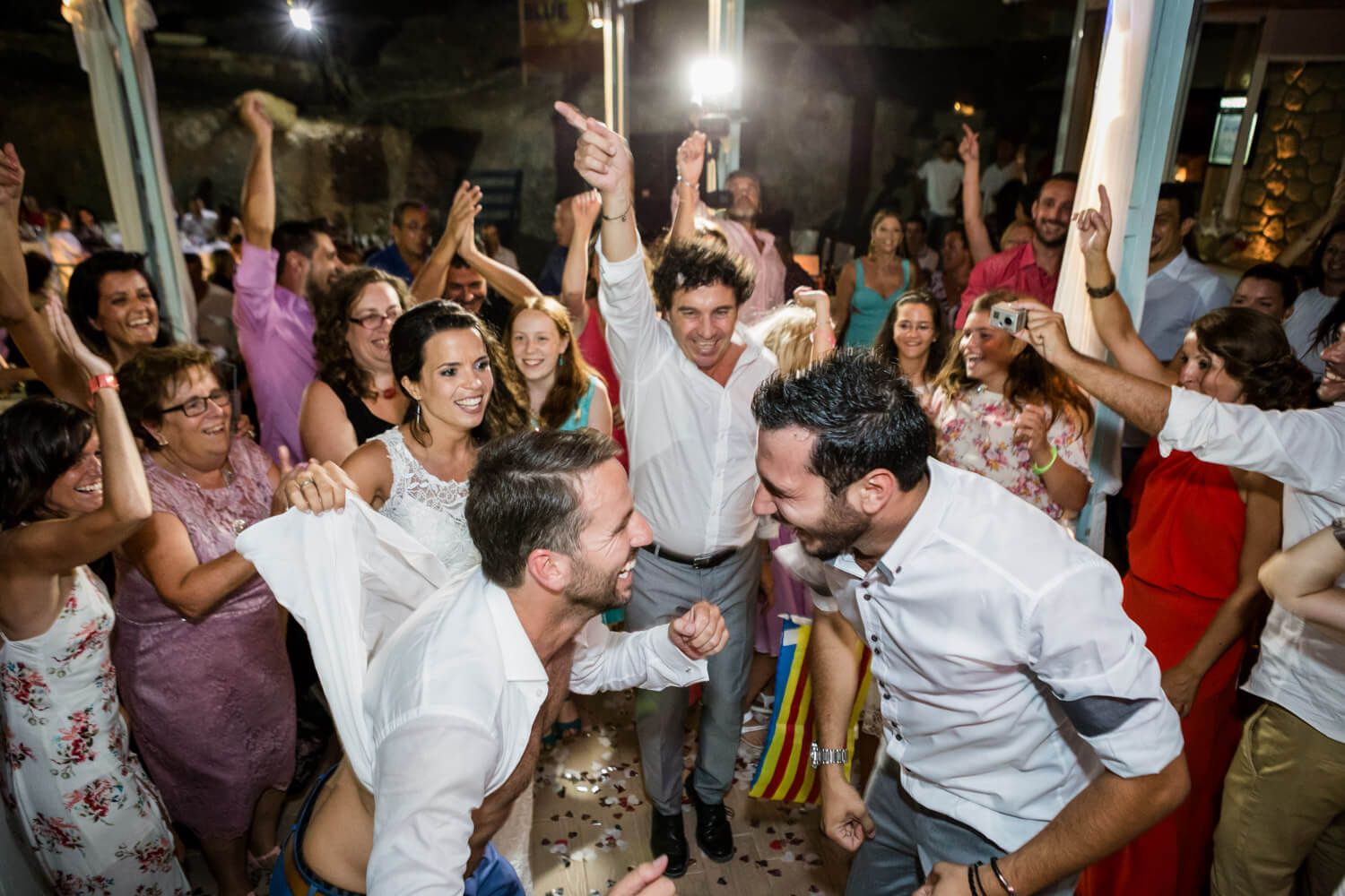 Spanish and Greek guests dancing together - Multicultural wedding
