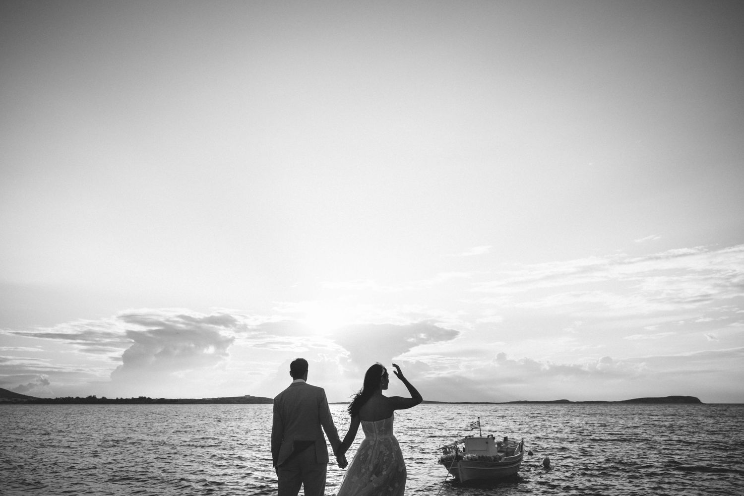 Cinematic wedding portraits at the edge of the water in Seesoo