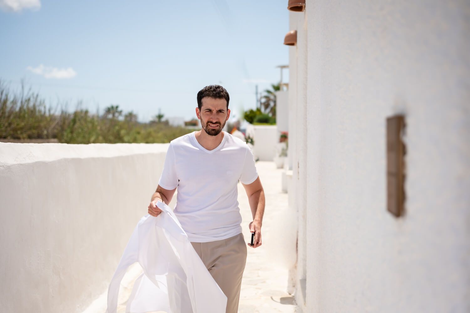 Groom Khalil getting ready for his symbolic Paros wedding at Seesoo