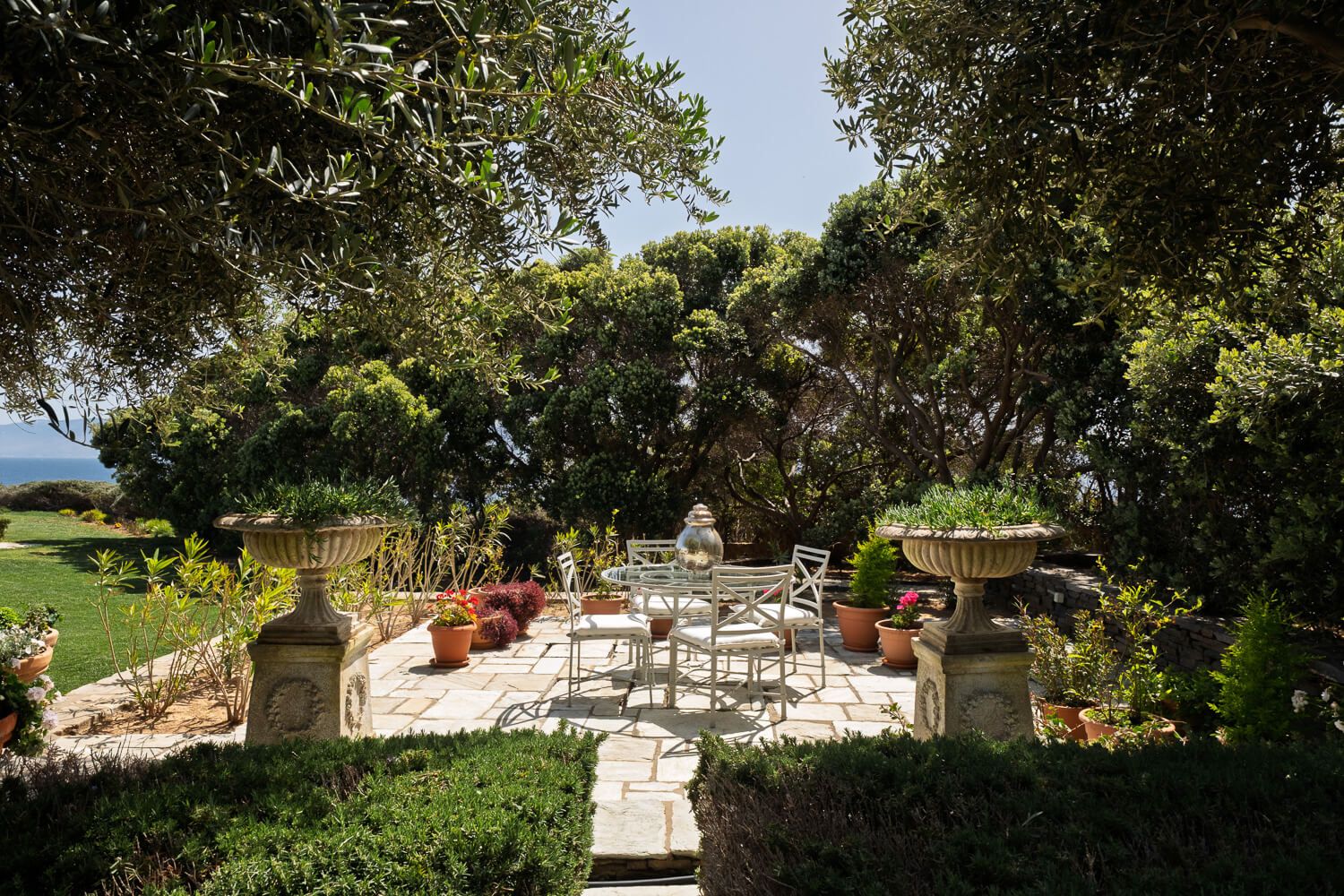 Expansive lush gardens surrounding a luxury estate in  Paros Greece