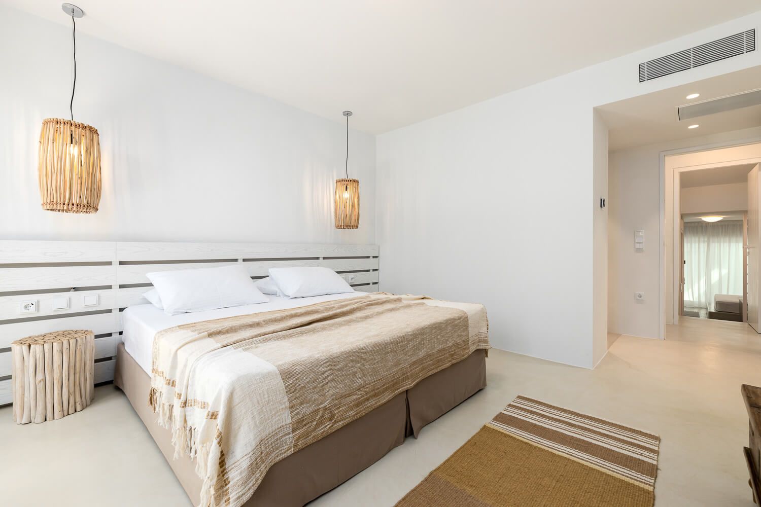 Inviting bedroom flooded with natural Cycladic light