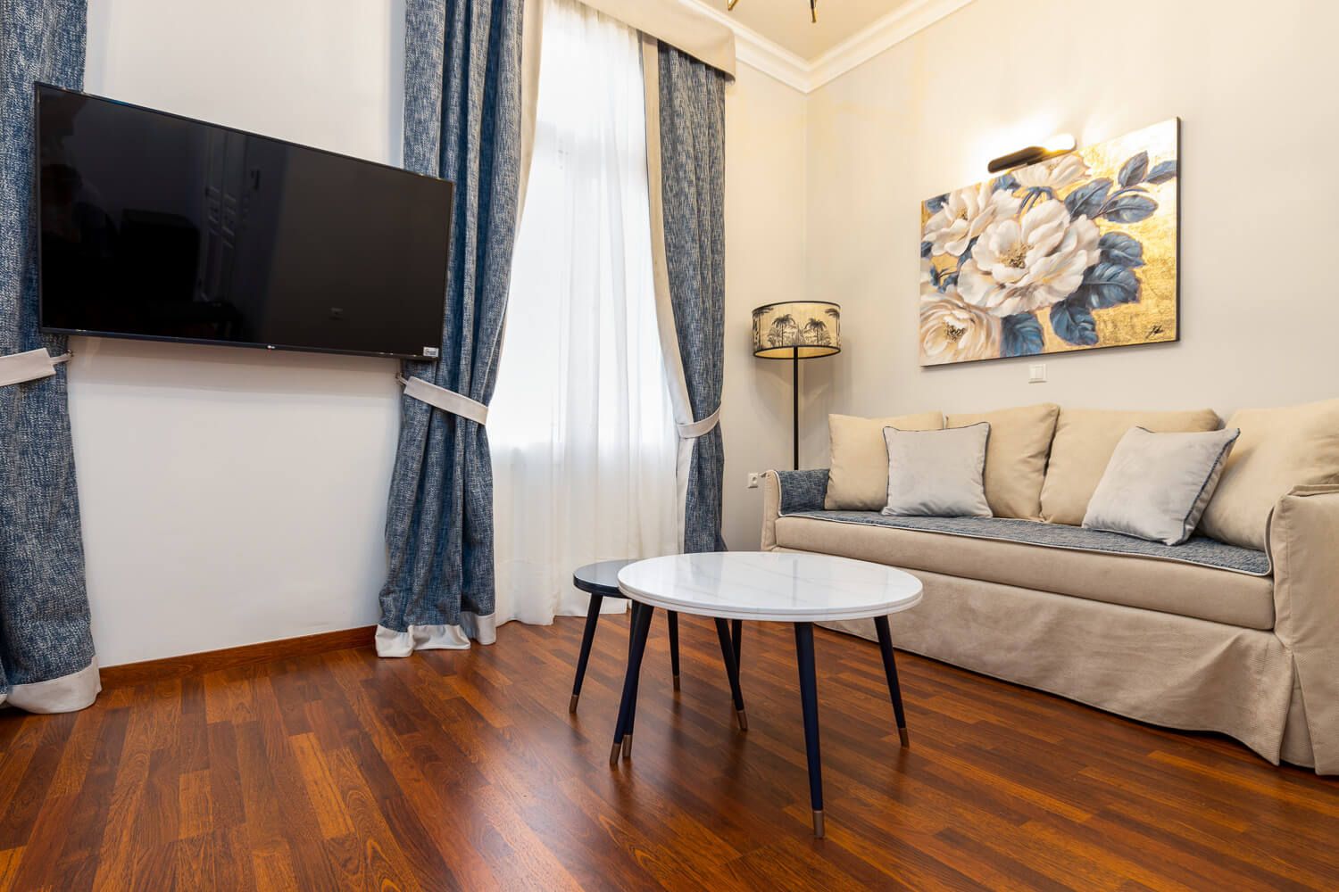 Hardwood floors and contemporary art in a luxury suite